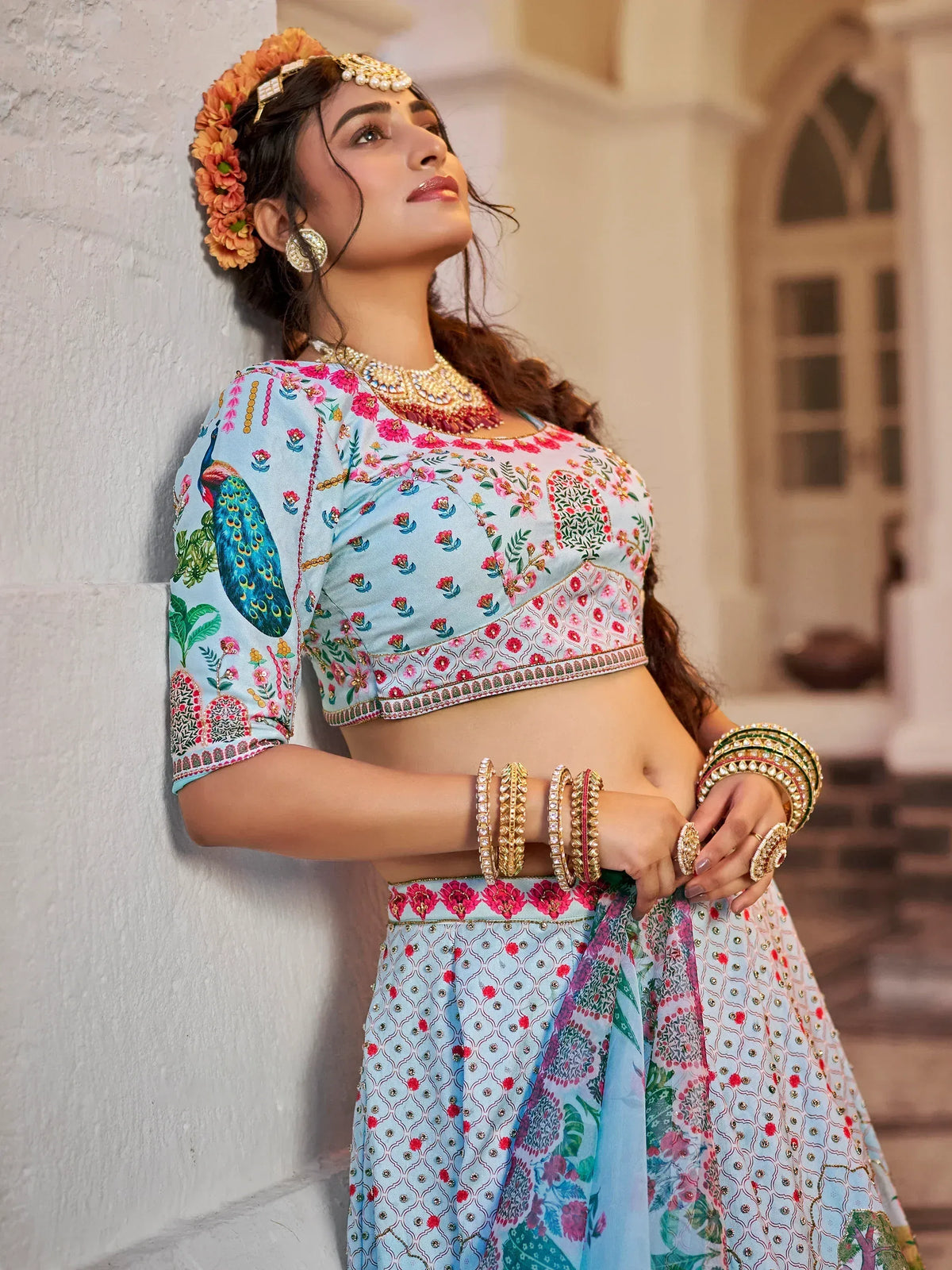 Woman in floral peacock print lehenga choli with traditional jewelry and flower crown, Indian ethnic wear
