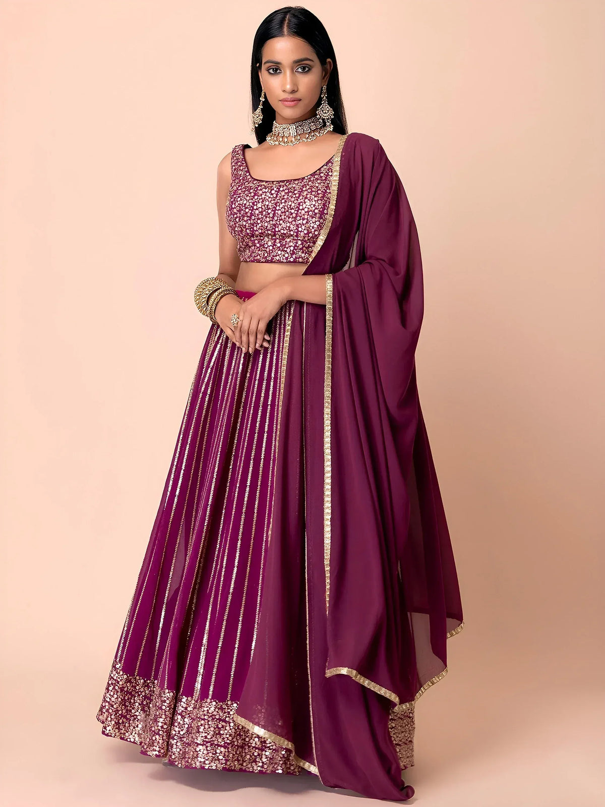 Purple designer lehenga choli with gold embroidery and sequins, perfect for Indian ethnic wear occasions
