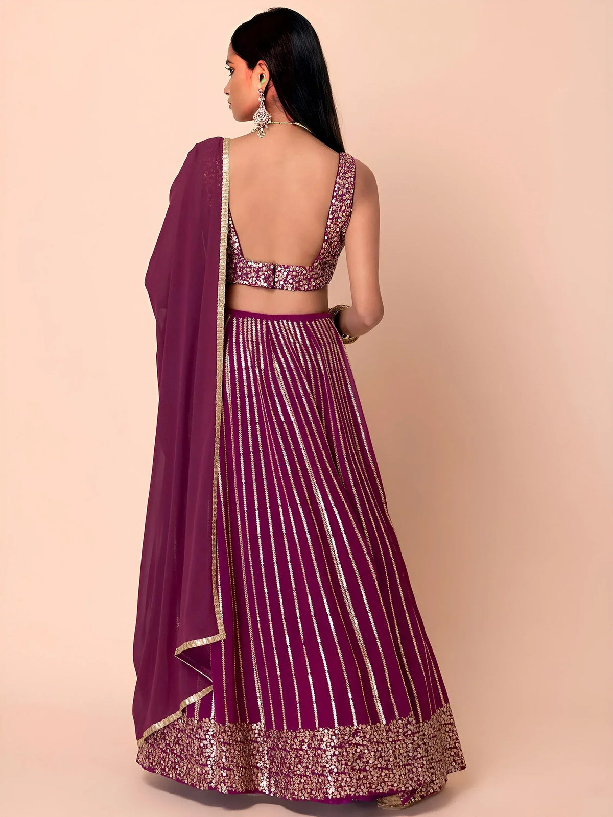 Purple lehenga choli with gold stripes and sequin border, back view