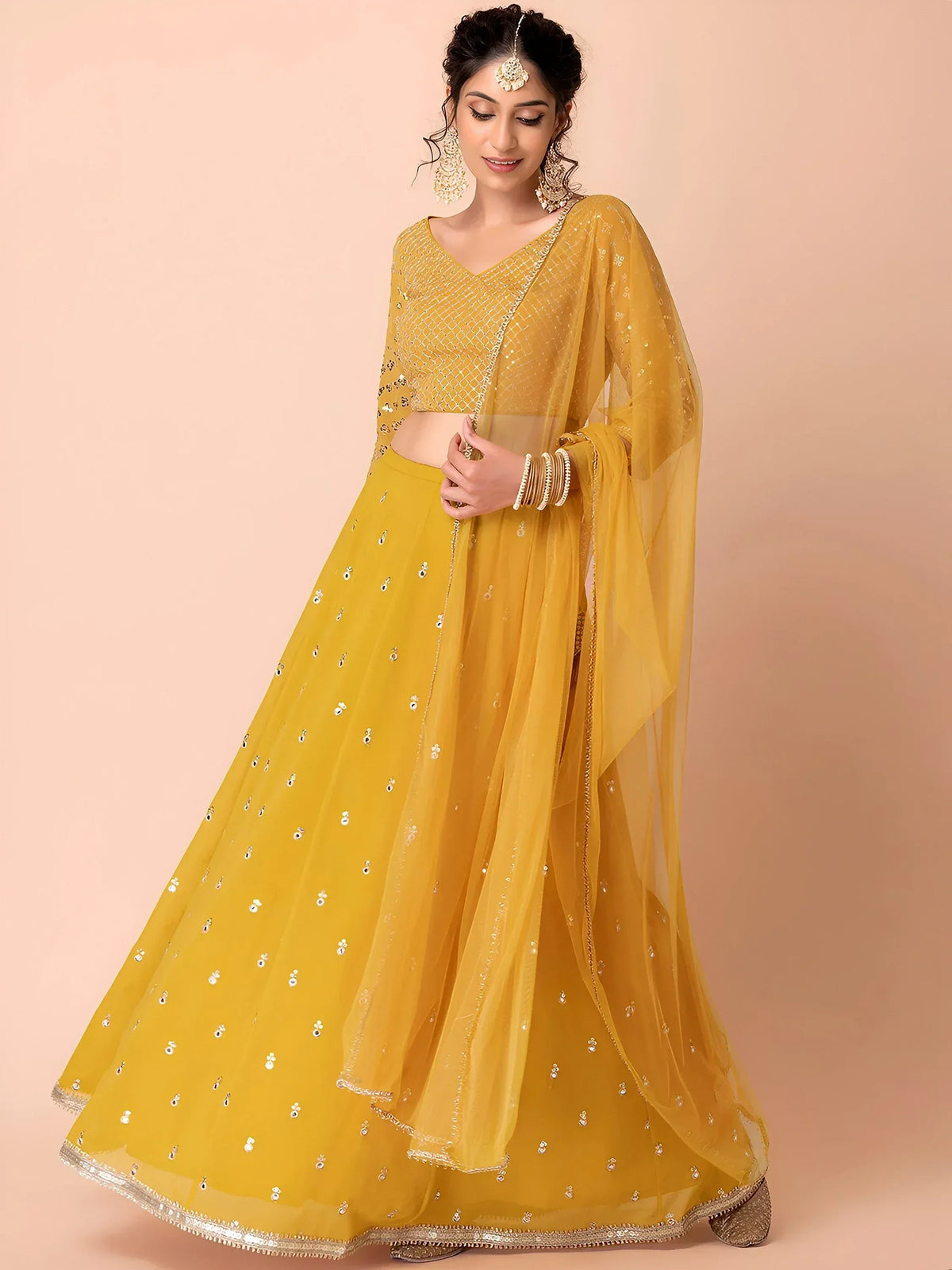 Yellow designer lehenga choli with sequin embroidery and sheer dupatta for Indian ethnic wear