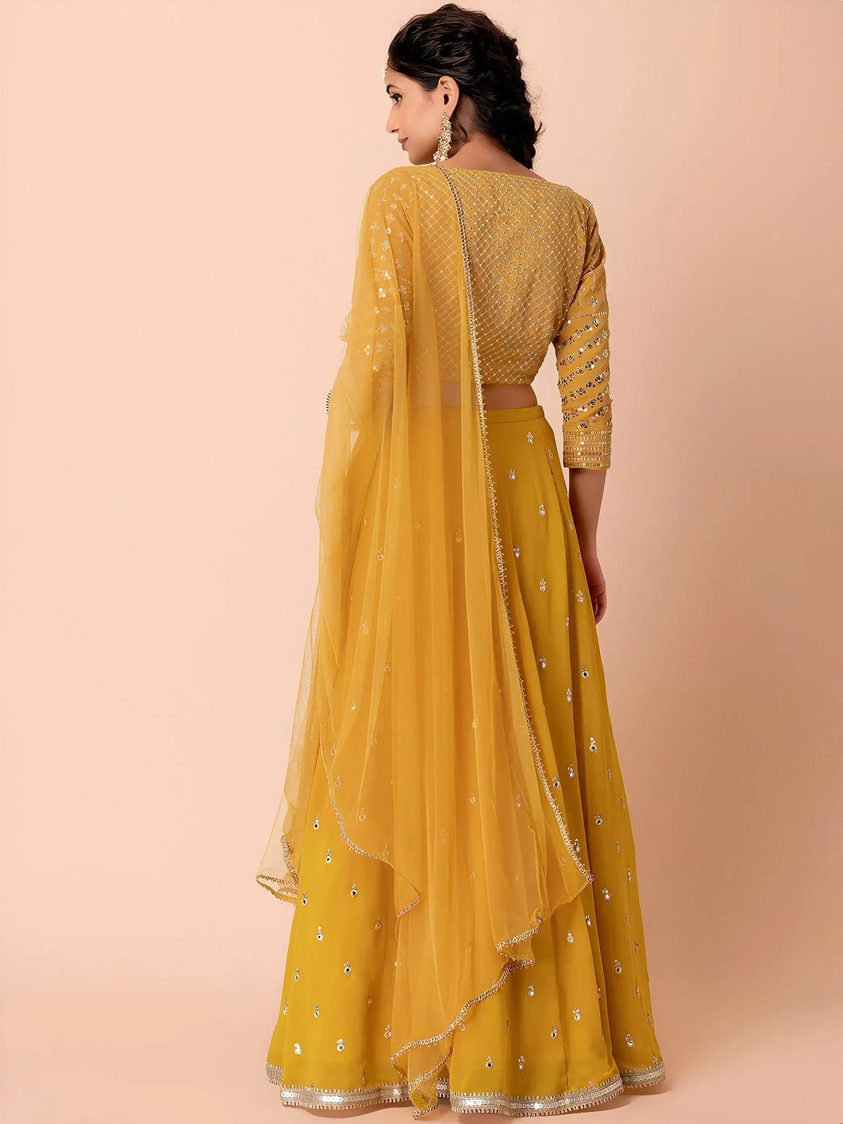 Mustard yellow designer lehenga choli with sequin embroidery and sheer dupatta, ethnic wear for women