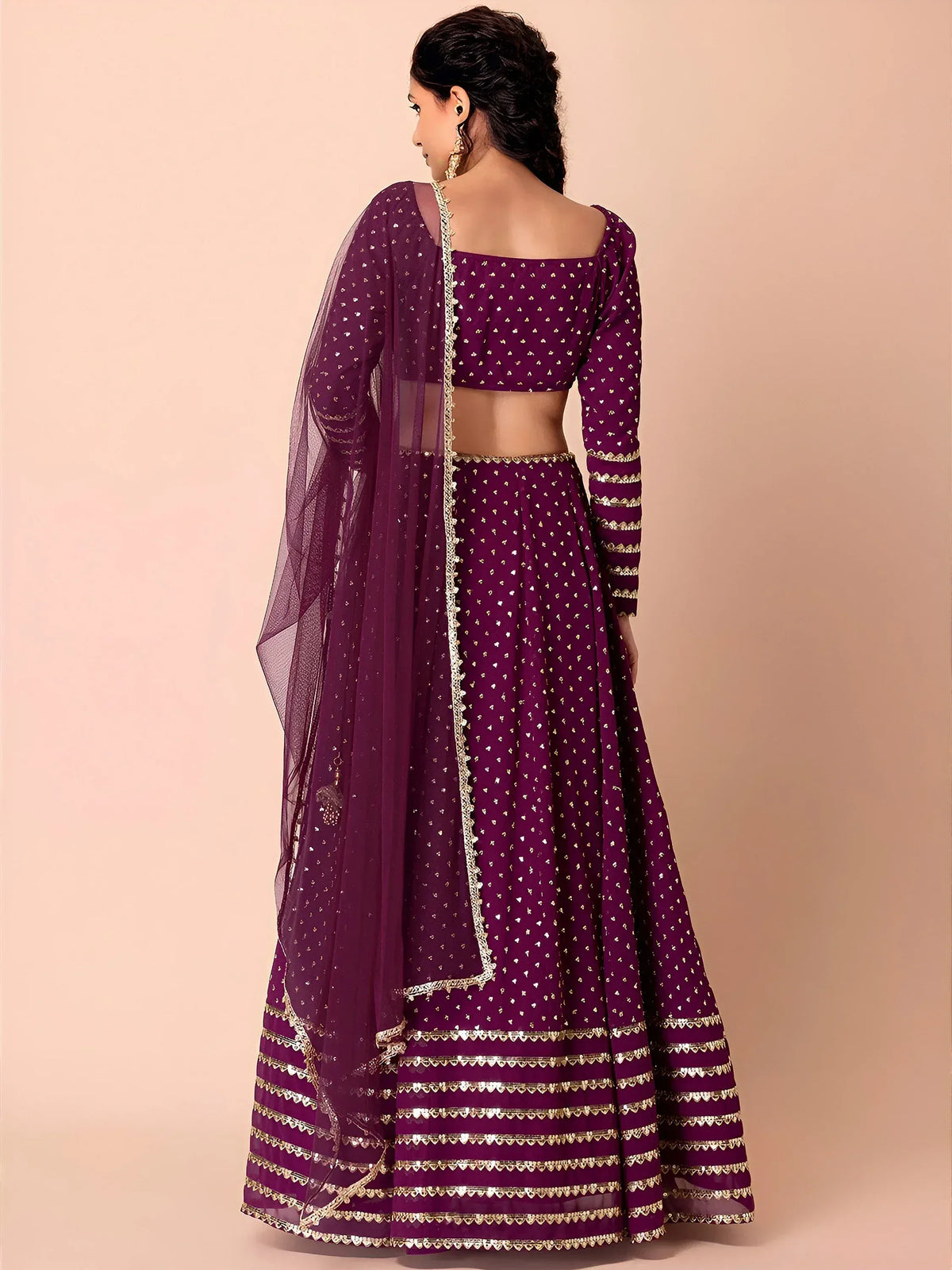 Purple designer lehenga choli with gold embroidery and sheer dupatta, ethnic Indian wear