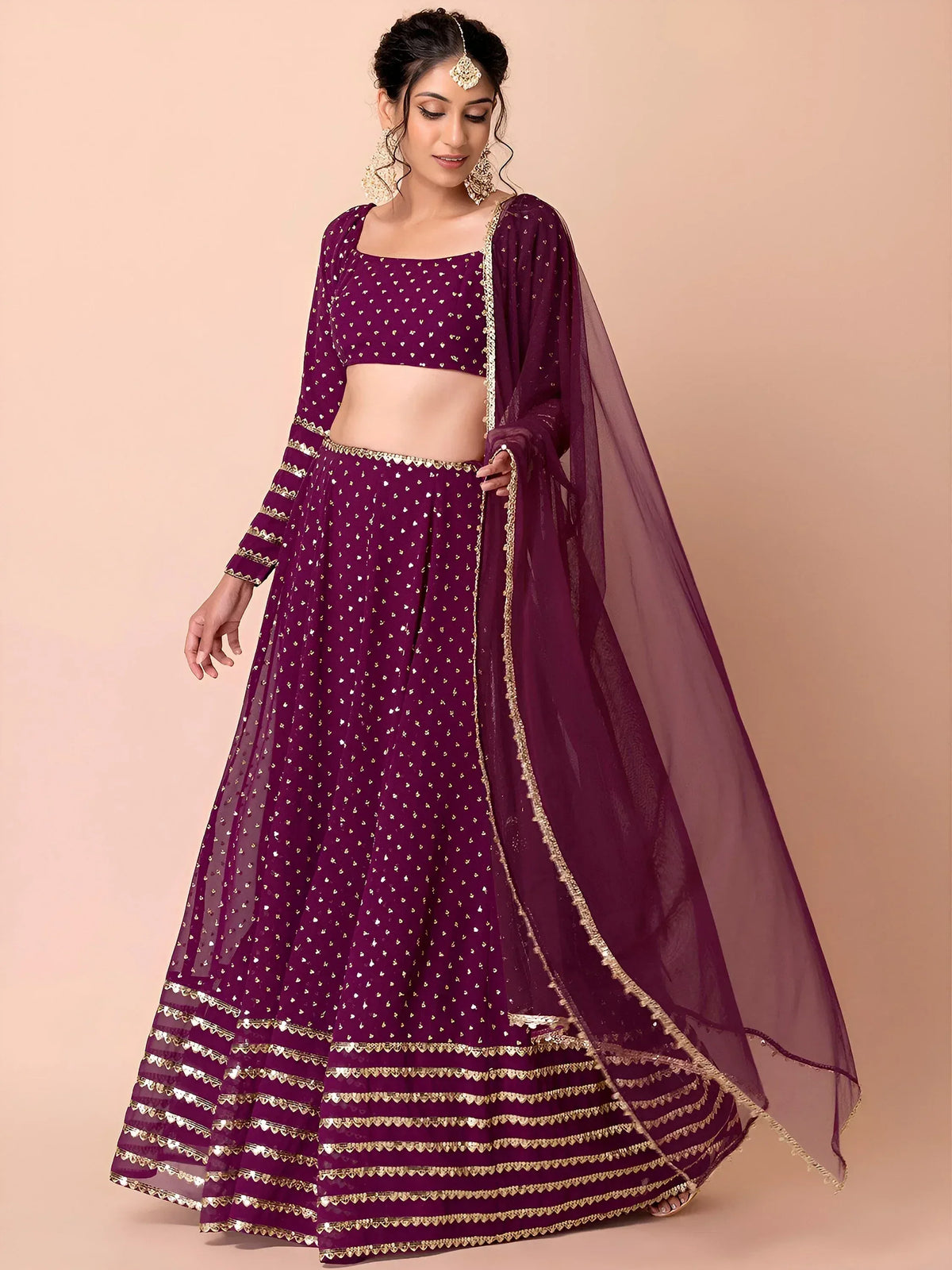 Purple designer lehenga choli with gold embroidery and sheer dupatta for Indian ethnic wear