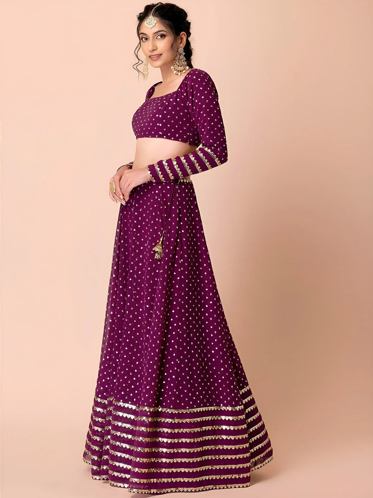 Purple designer lehenga choli with gold embroidery, perfect for Indian ethnic wear and festive occasions.