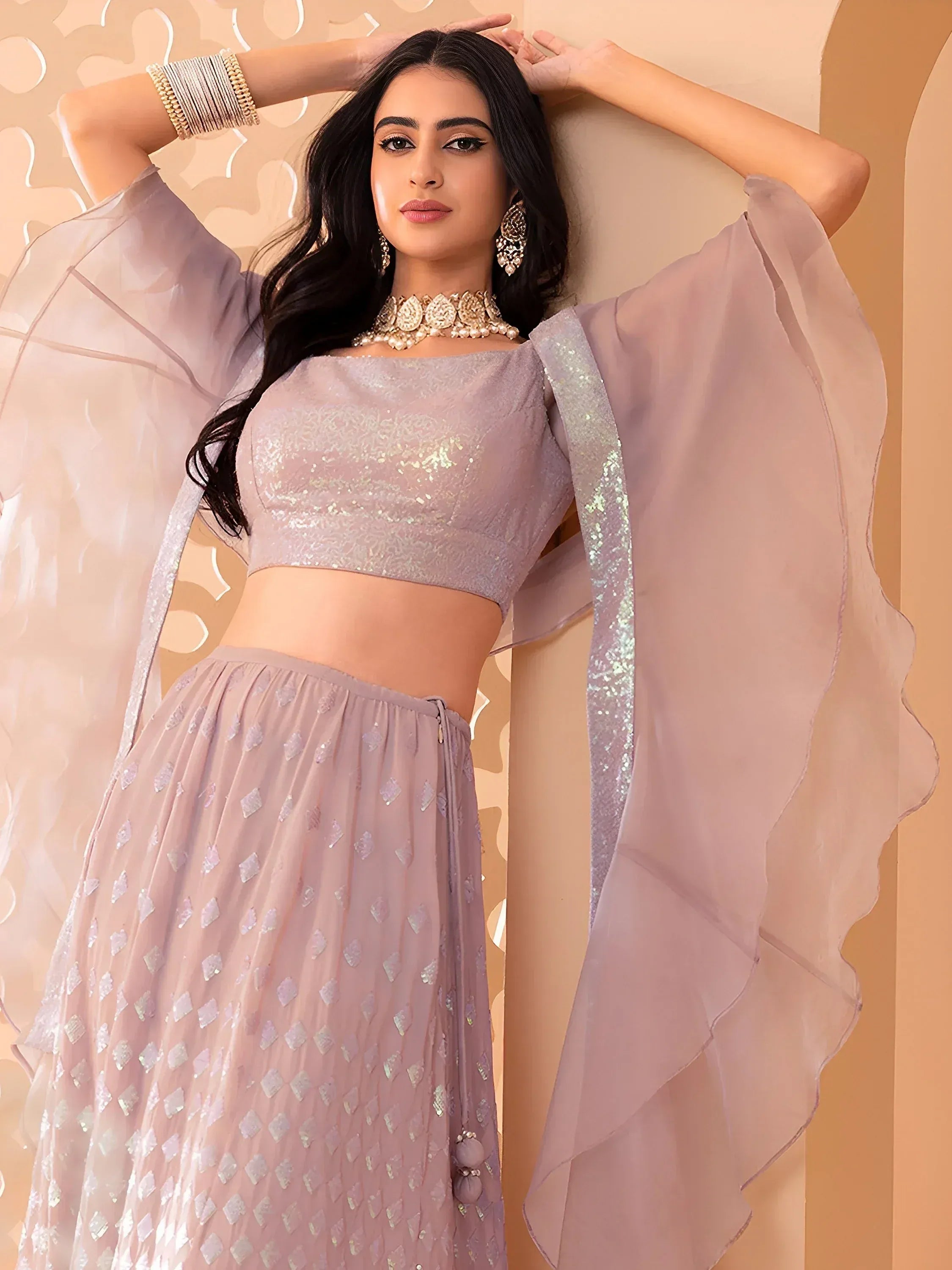 Elegant lavender lehenga choli with sequin embroidery and sheer cape, perfect for Indian ethnic occasions