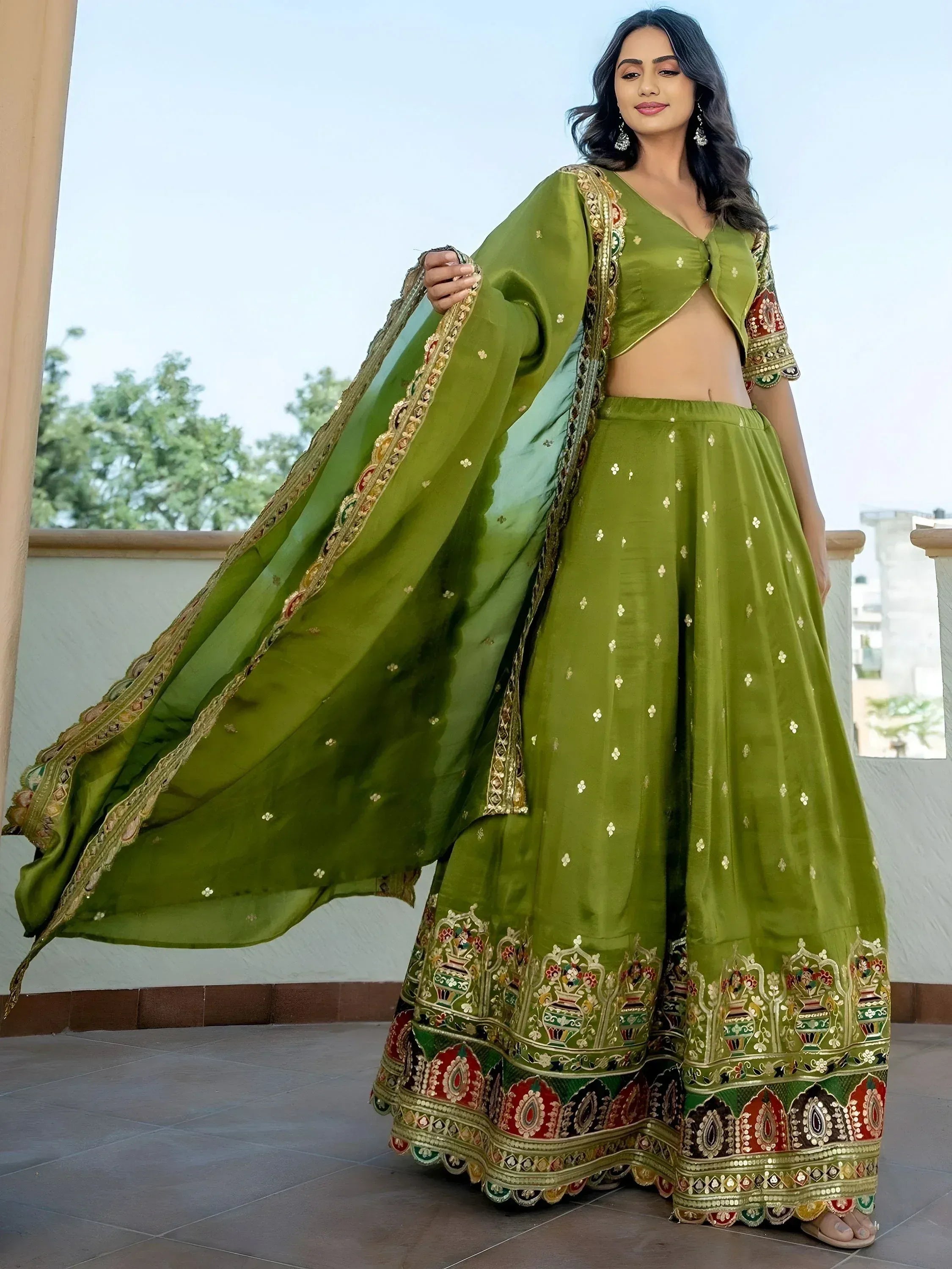 Green embroidered lehenga choli with floral motifs and dupatta, perfect for Indian ethnic wear