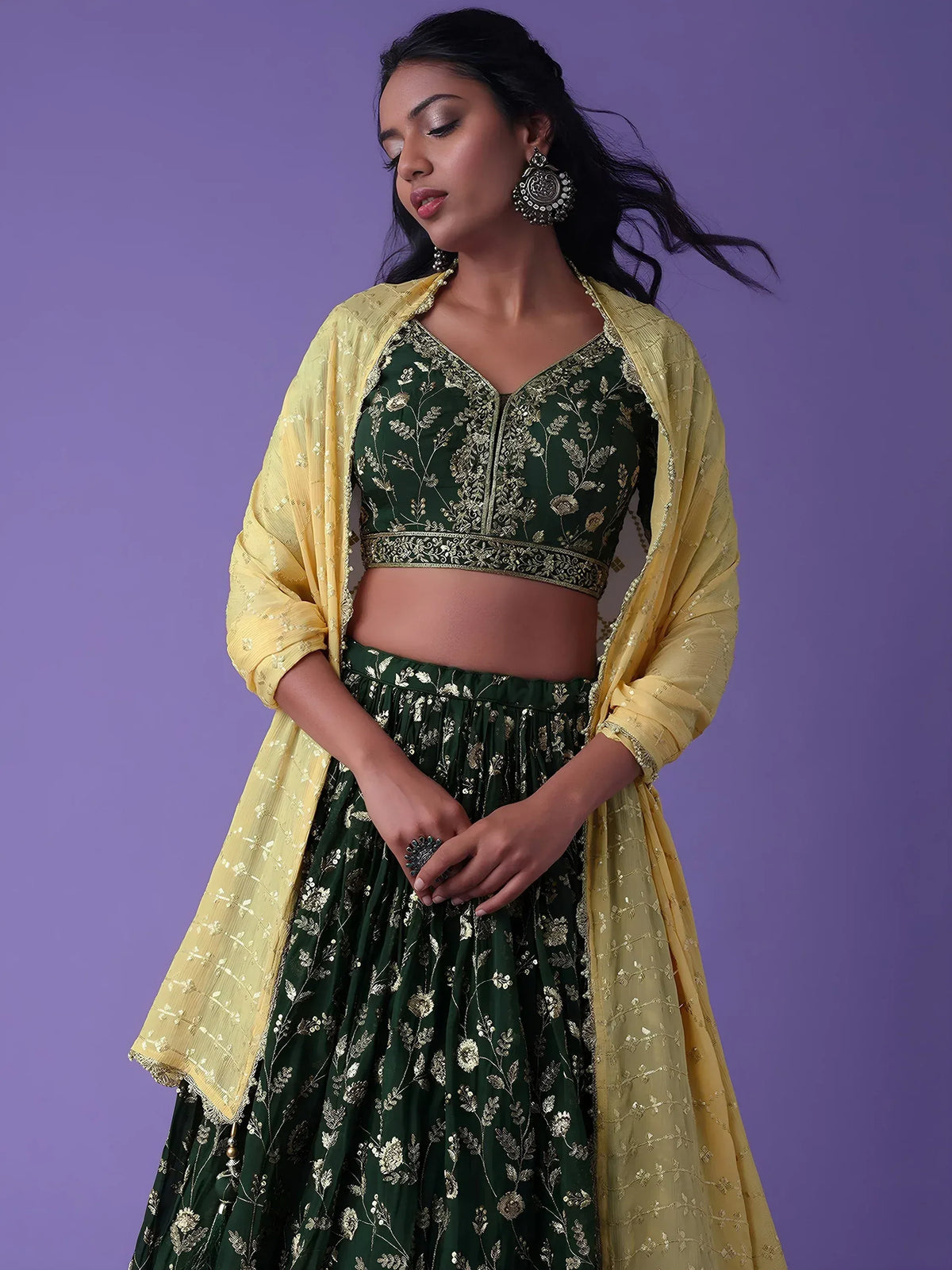 Emerald green embroidered lehenga choli with yellow dupatta, perfect for Indian ethnic wear occasions.