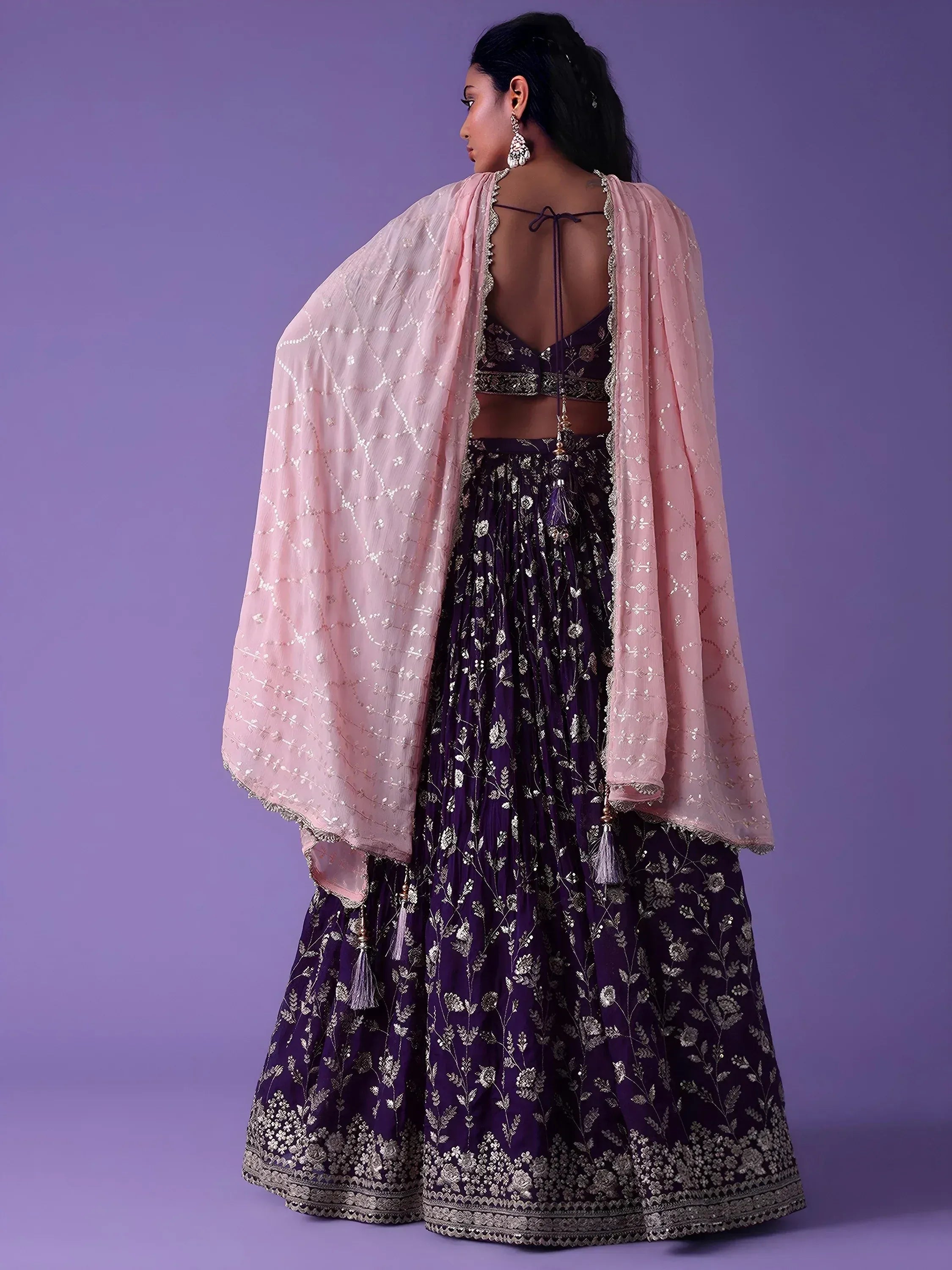 Purple floral embroidered lehenga choli with pink dupatta, back view
