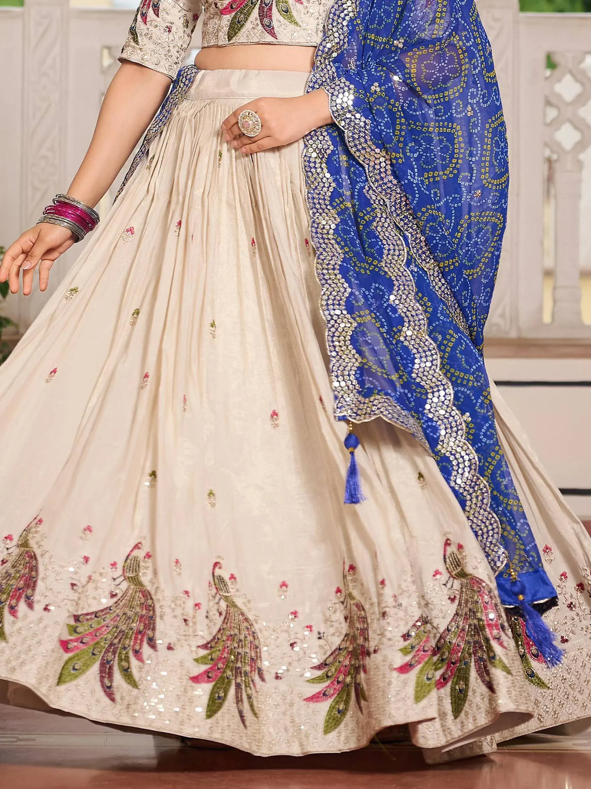 Cream lehenga with peacock embroidery and blue dupatta, Indian ethnic wear for weddings