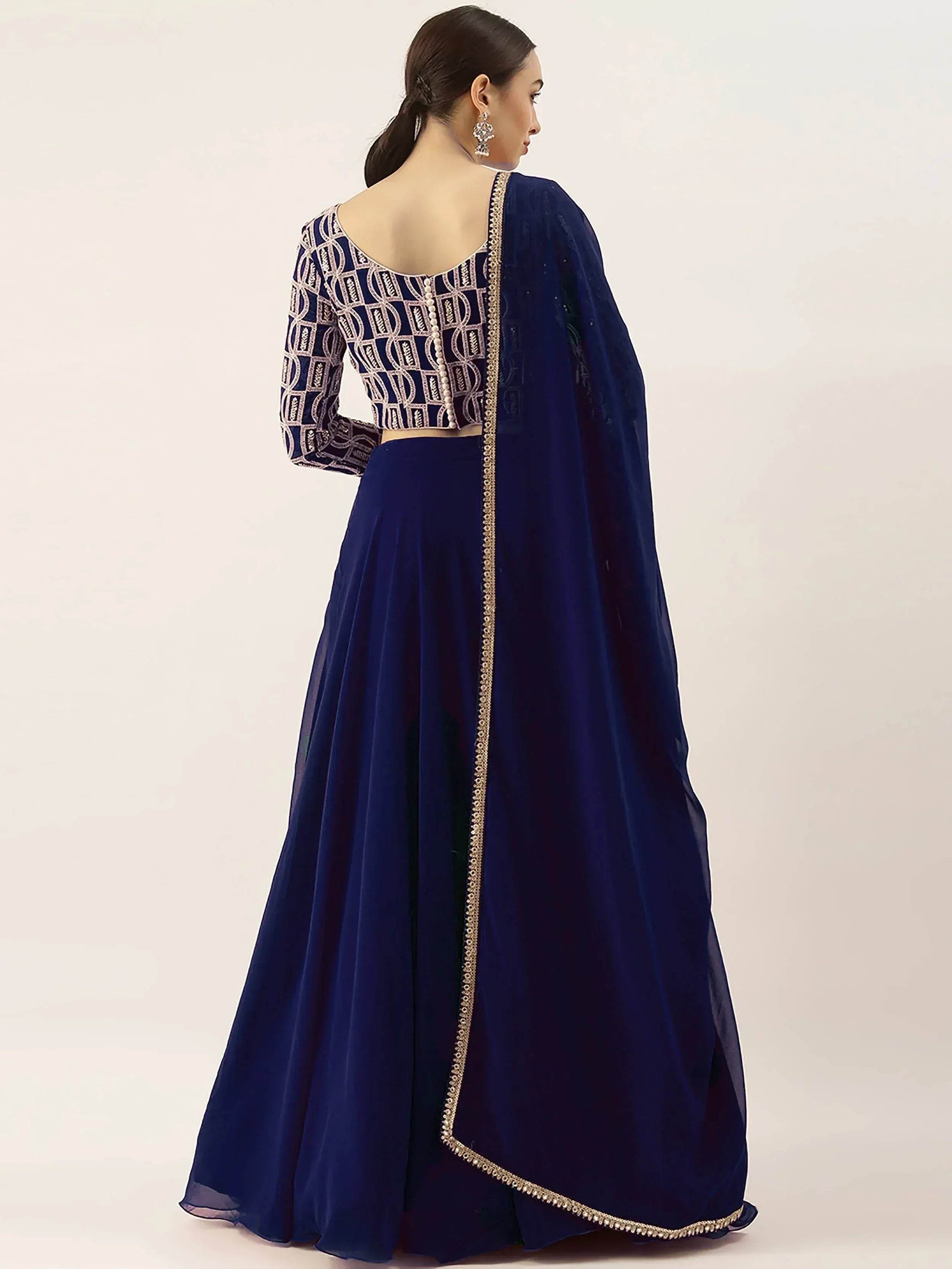 Navy blue designer lehenga choli with geometric embroidery and gold trim, perfect for Indian ethnic wear