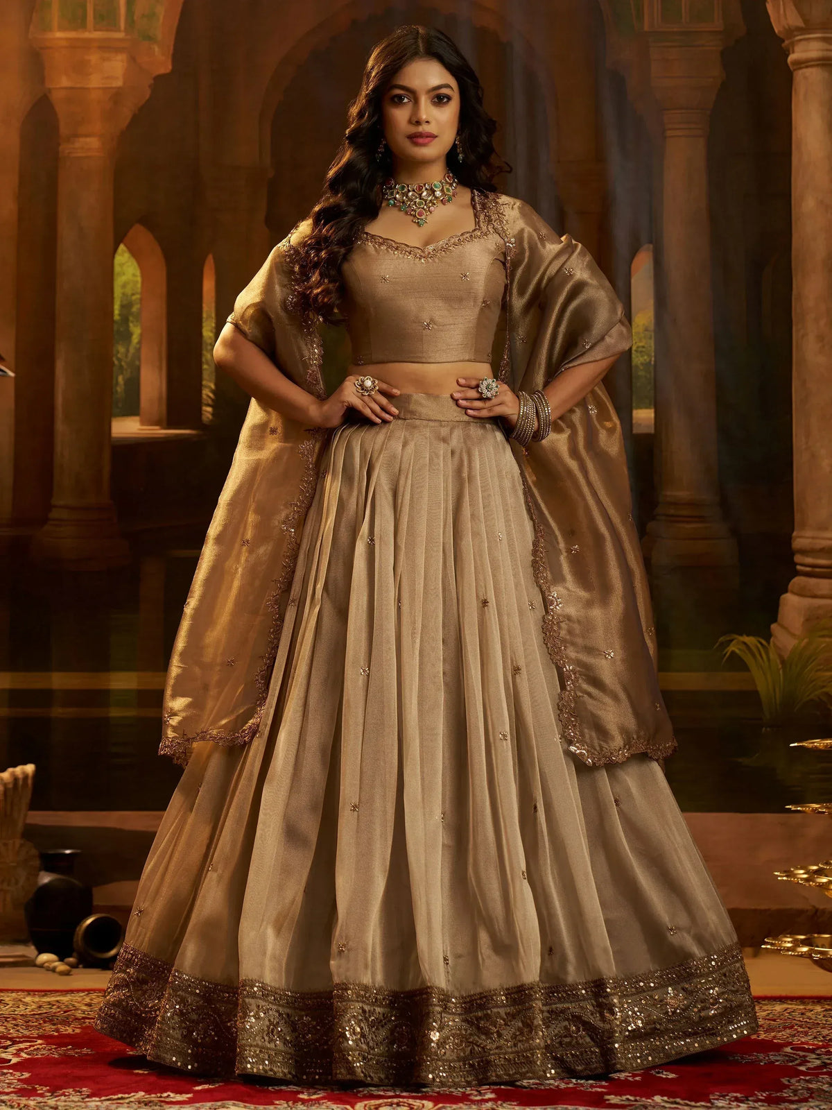 Elegant gold lehenga choli with intricate embroidery, perfect for Indian weddings and festive occasions.