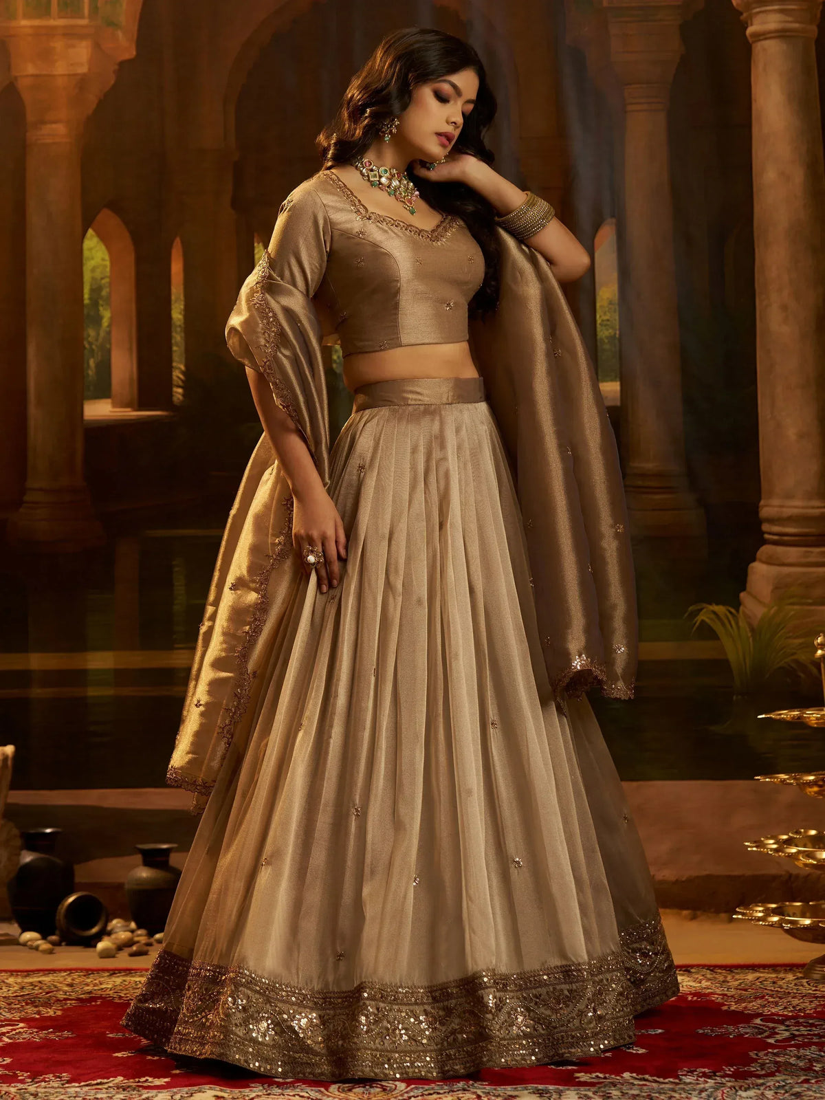 Elegant gold lehenga choli with intricate embroidery, perfect for Indian weddings and festive occasions.