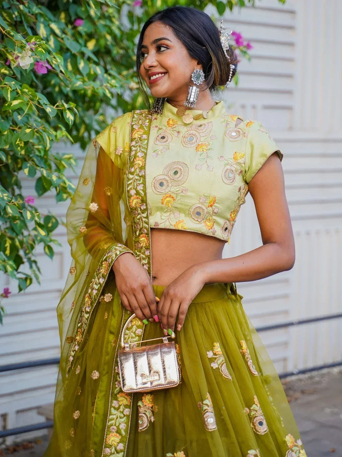 Elegant green embroidered lehenga choli with floral designs and matching dupatta, perfect for Indian ethnic wear.