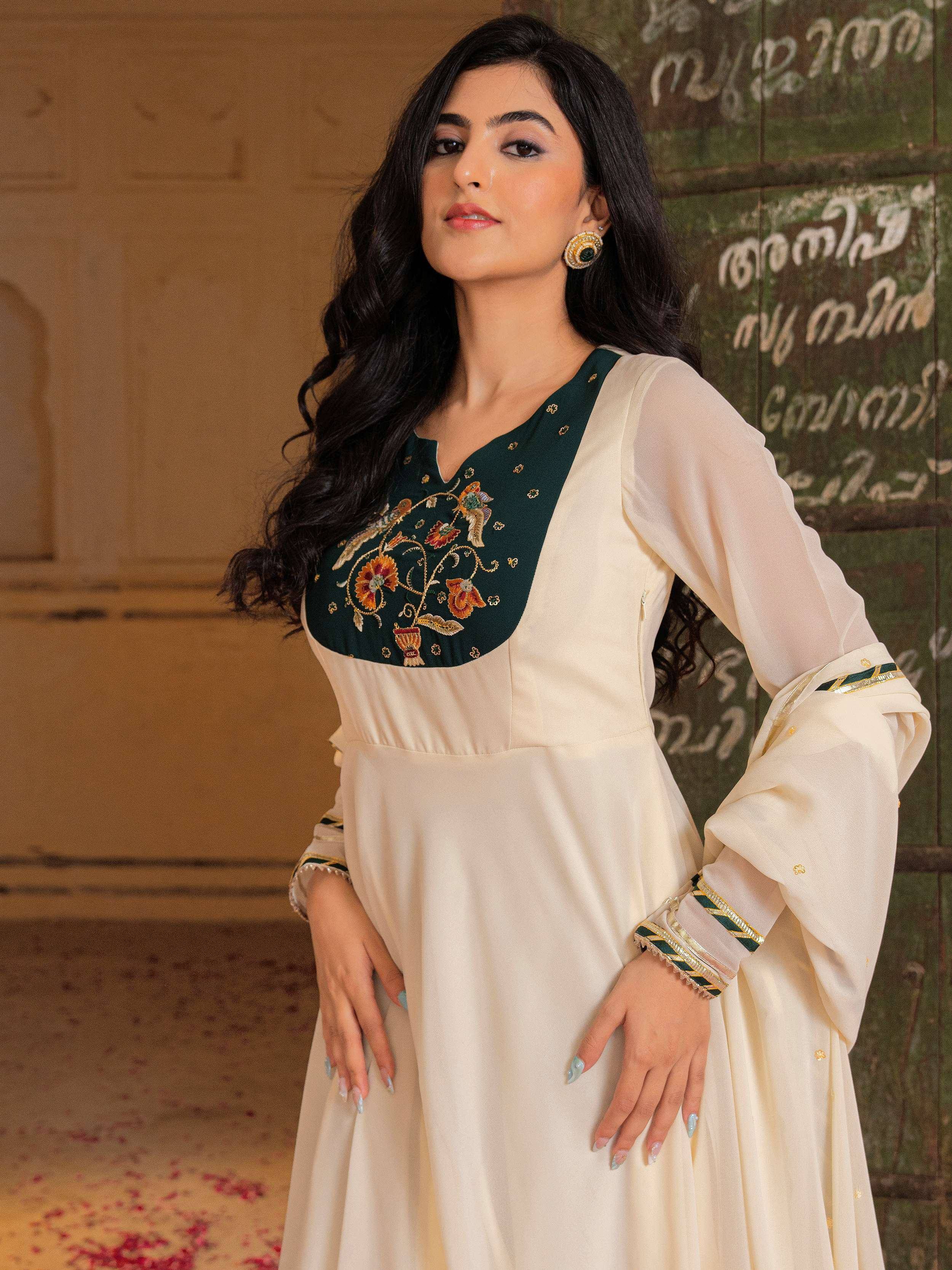 Elegant cream and green embroidered ethnic gown with floral detailing