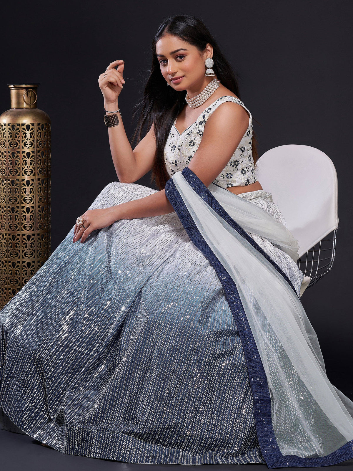 Elegant blue and white sequined lehenga choli with floral blouse, perfect for Indian ethnic wear