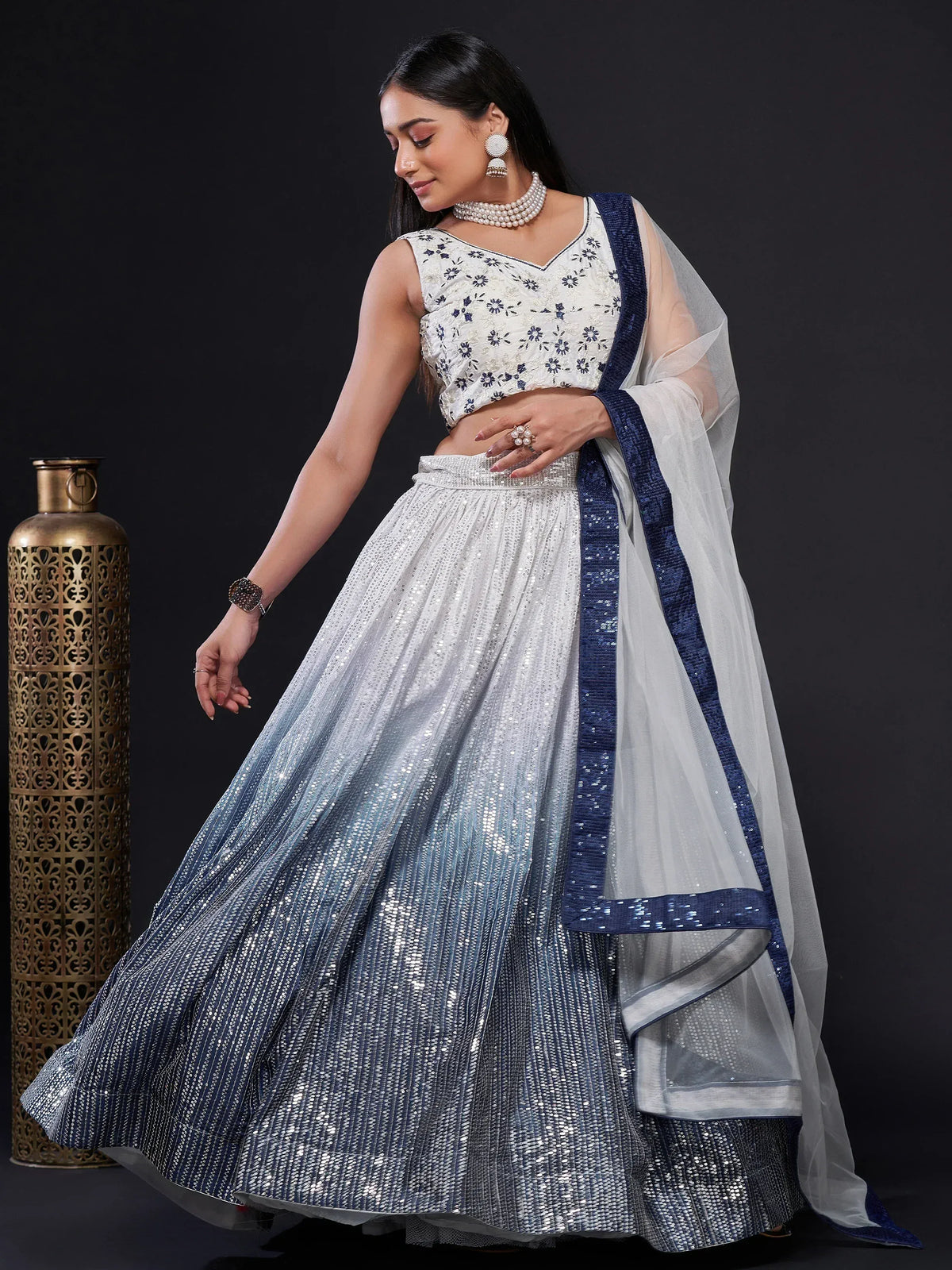 Elegant white and blue sequin lehenga choli with floral embroidery, perfect for Indian ethnic occasions
