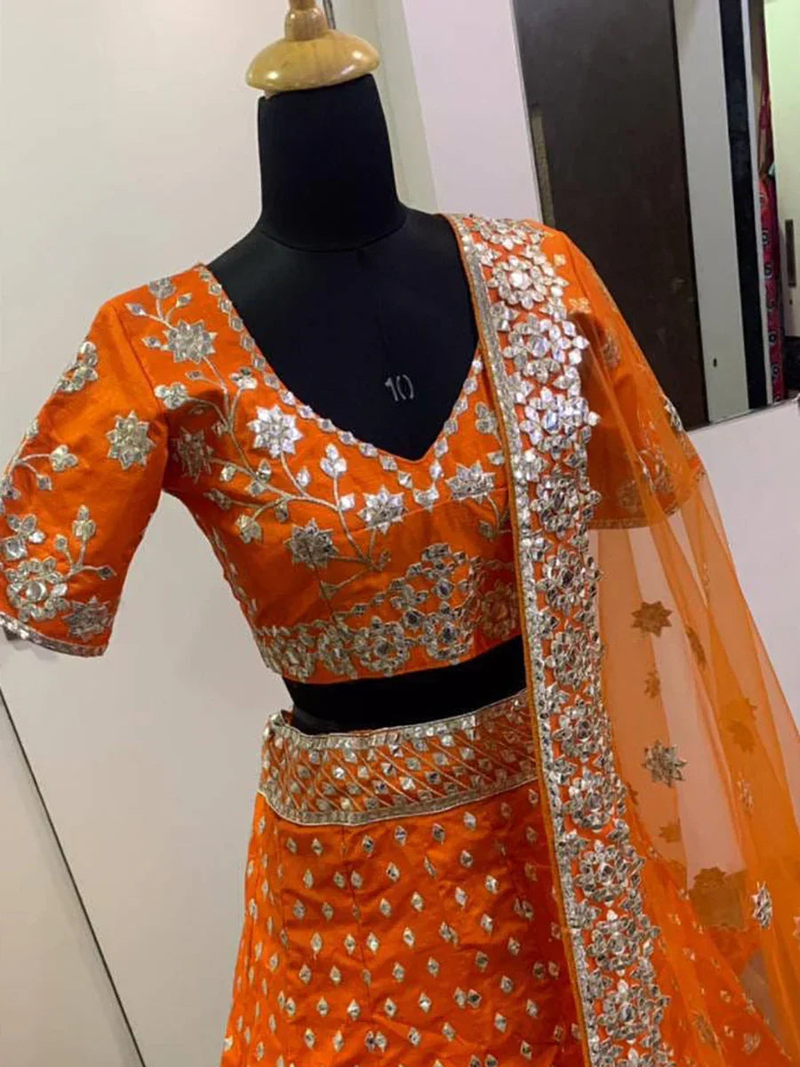 Delicate Orange Zari Work Silk Lehenga Choli With Net Dupatta
