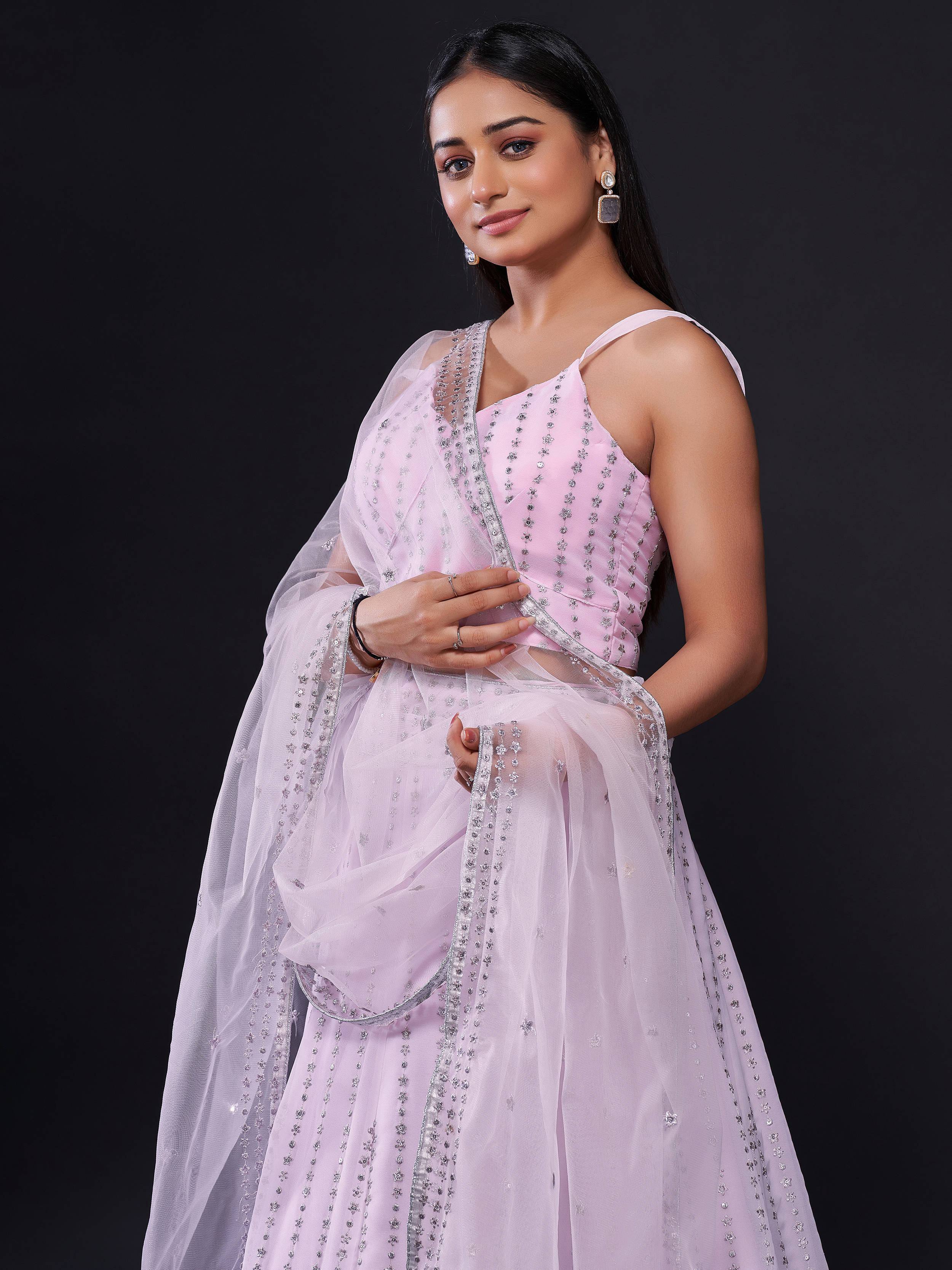Elegant pink designer lehenga choli with silver embellishments and sheer dupatta
