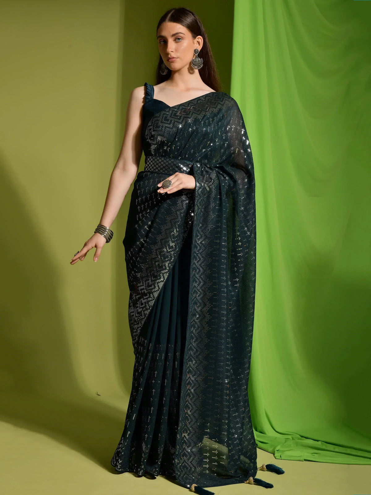 Elegant dark green sequin saree with one-shoulder blouse, perfect for Indian ethnic occasions