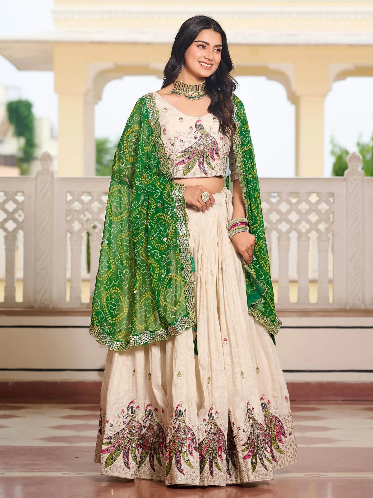 Cream peacock-embroidered lehenga choli with green dupatta, Indian ethnic wear for weddings