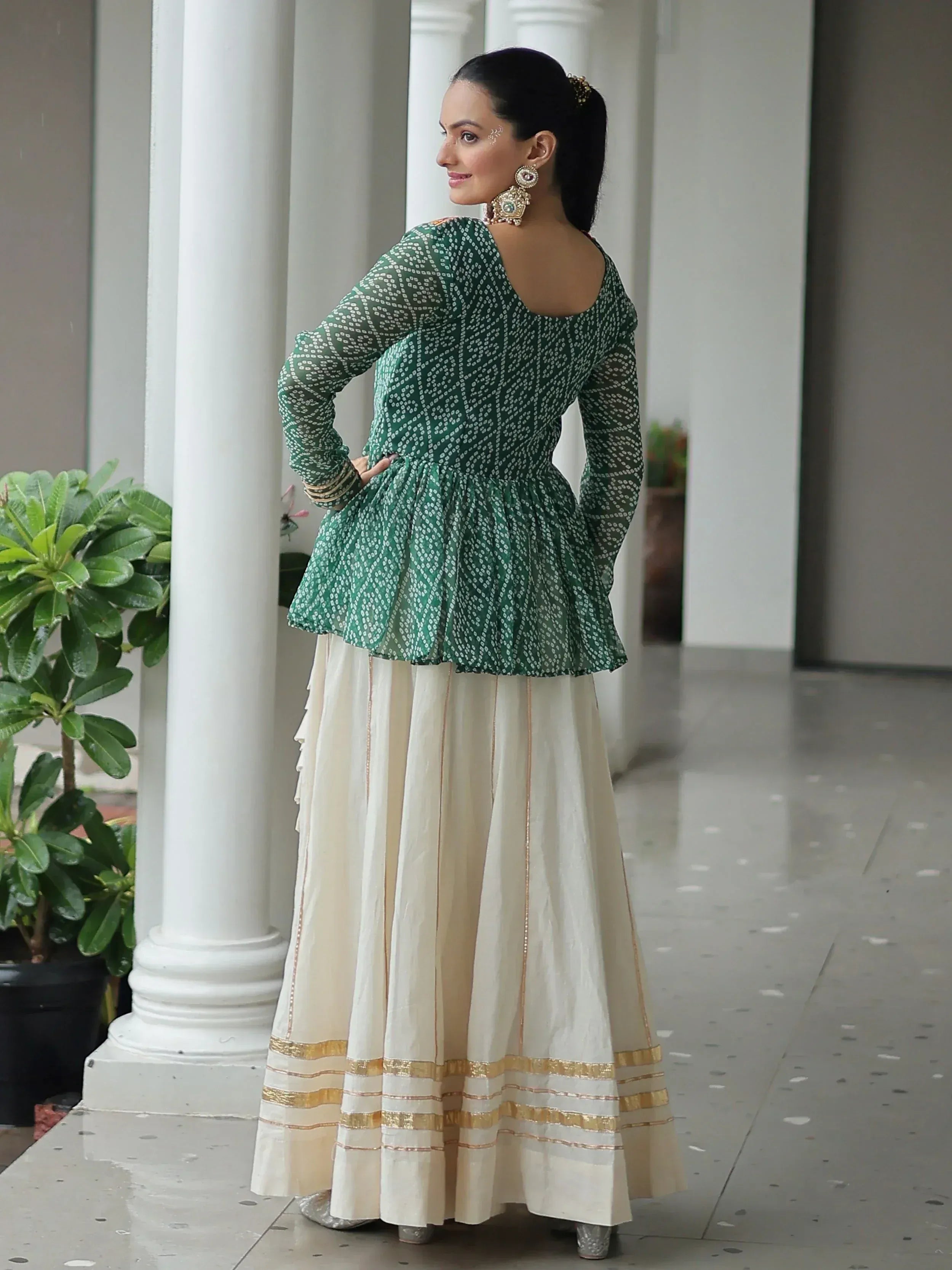 Green printed peplum top with cream skirt, Indian ethnic wear for women