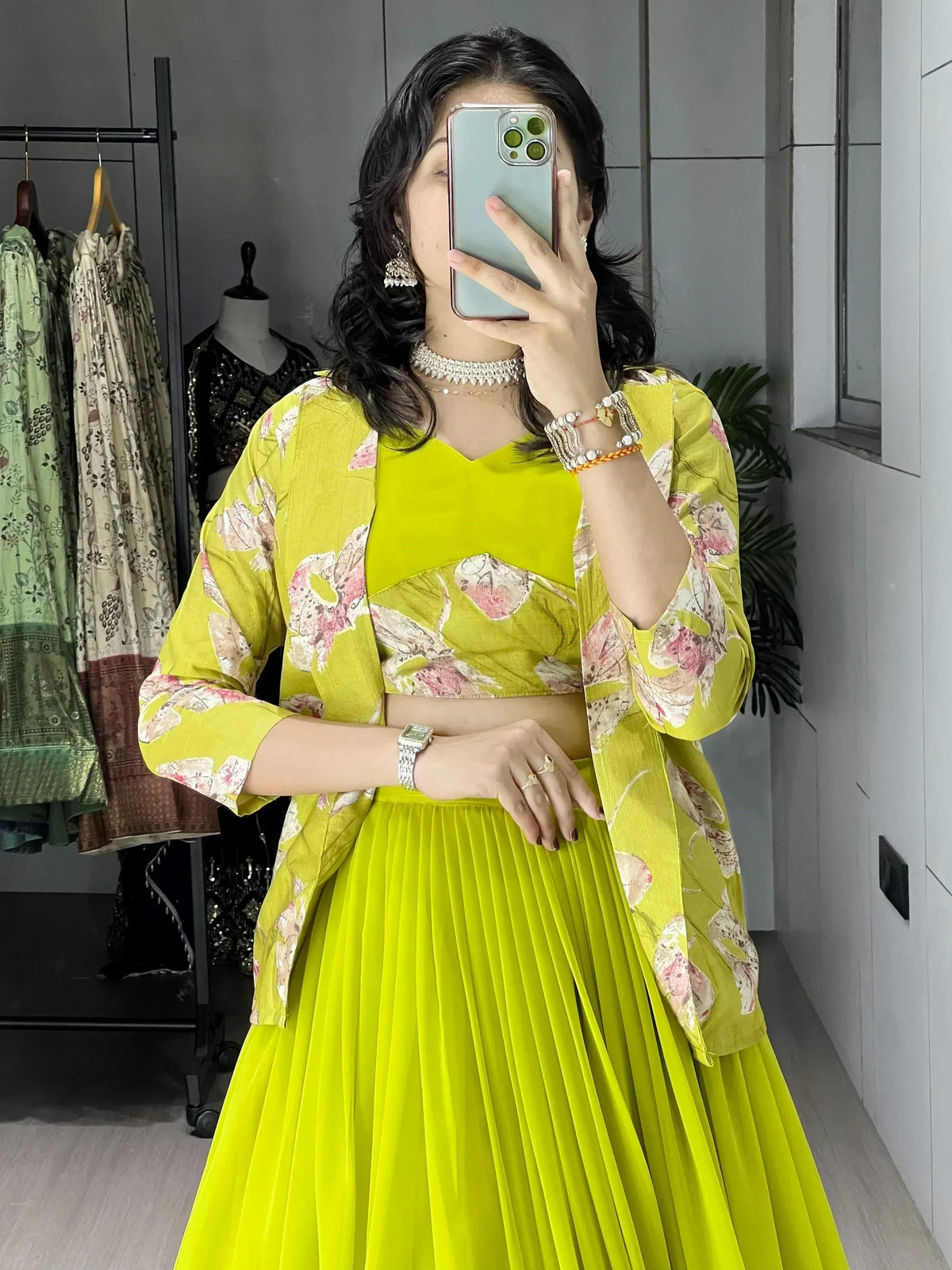 Vibrant yellow floral lehenga choli with pleated skirt, perfect for Indian ethnic wear occasions.