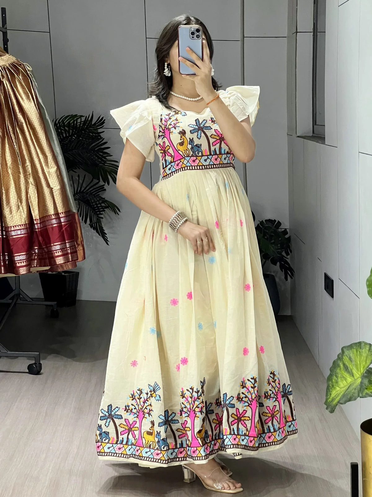Cream ethnic gown with colorful tree and deer embroidery, puff sleeves, perfect for Indian occasions