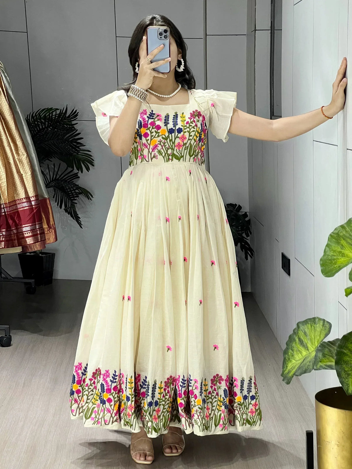 Cream floral embroidered ethnic gown with puff sleeves, perfect for Indian occasions and festive wear.