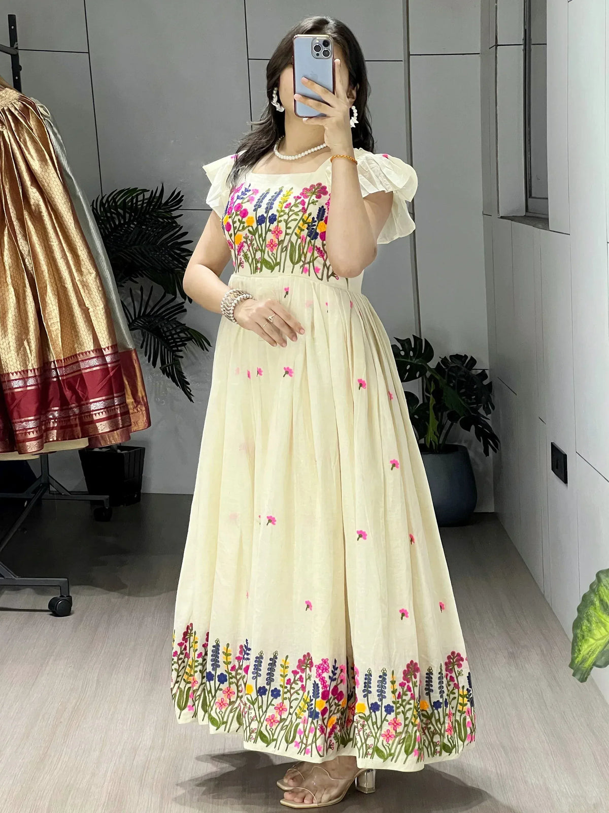 Cream floral embroidered ethnic gown with puff sleeves, perfect for Indian occasions and festive wear.