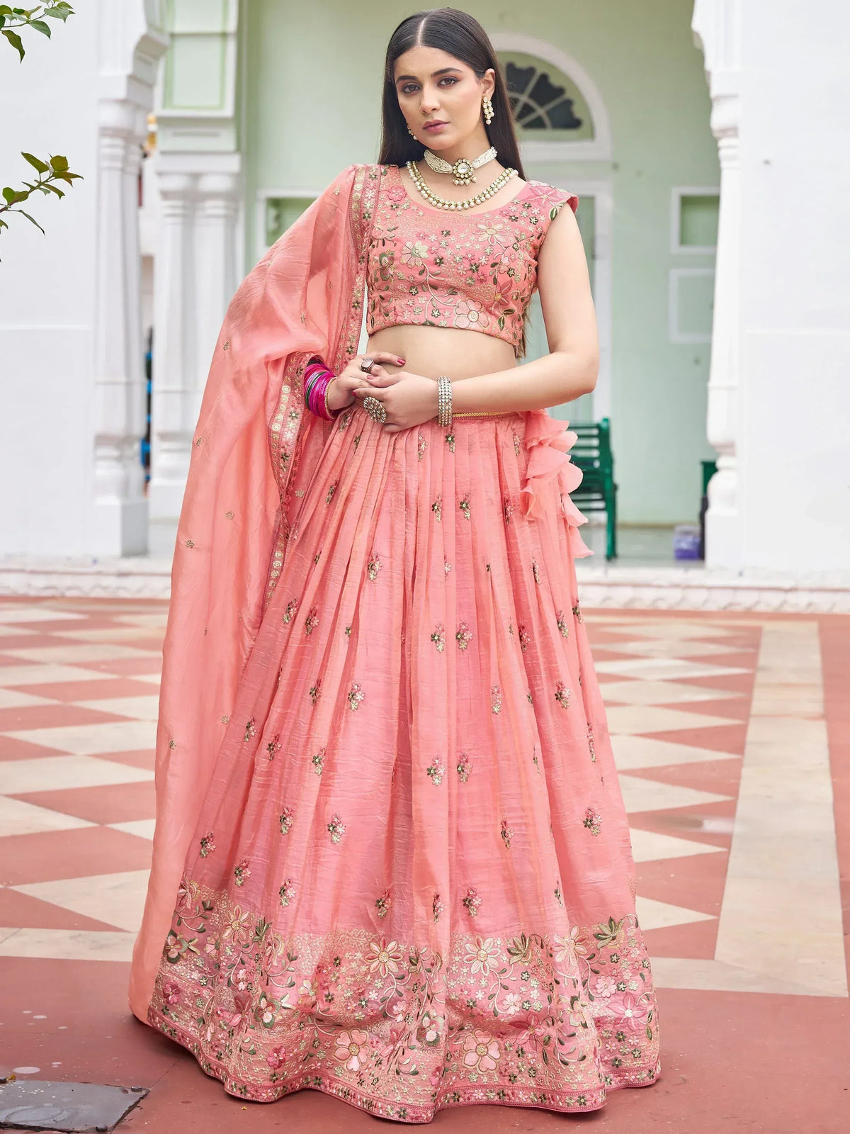 Pink floral embroidered lehenga choli with ruffled skirt and dupatta, perfect for Indian ethnic occasions