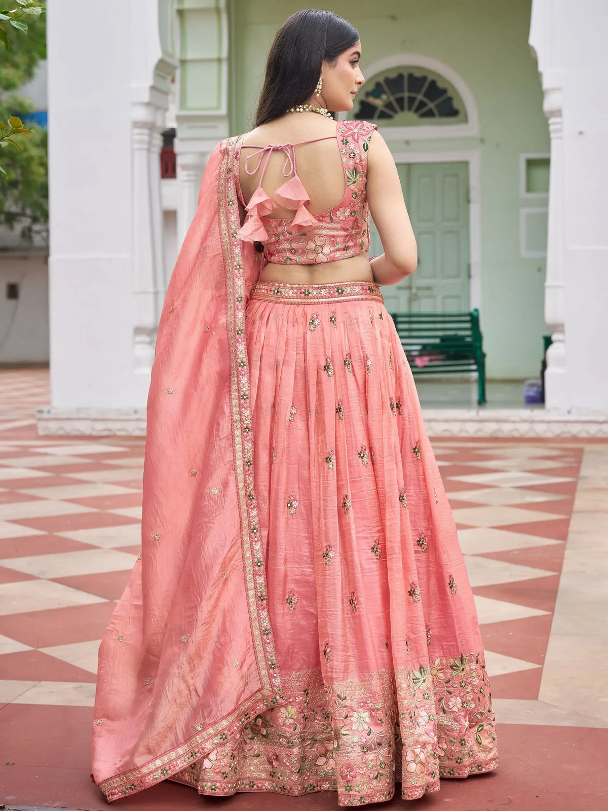 Pink floral embroidered lehenga choli with ruffle back, perfect for Indian ethnic occasions