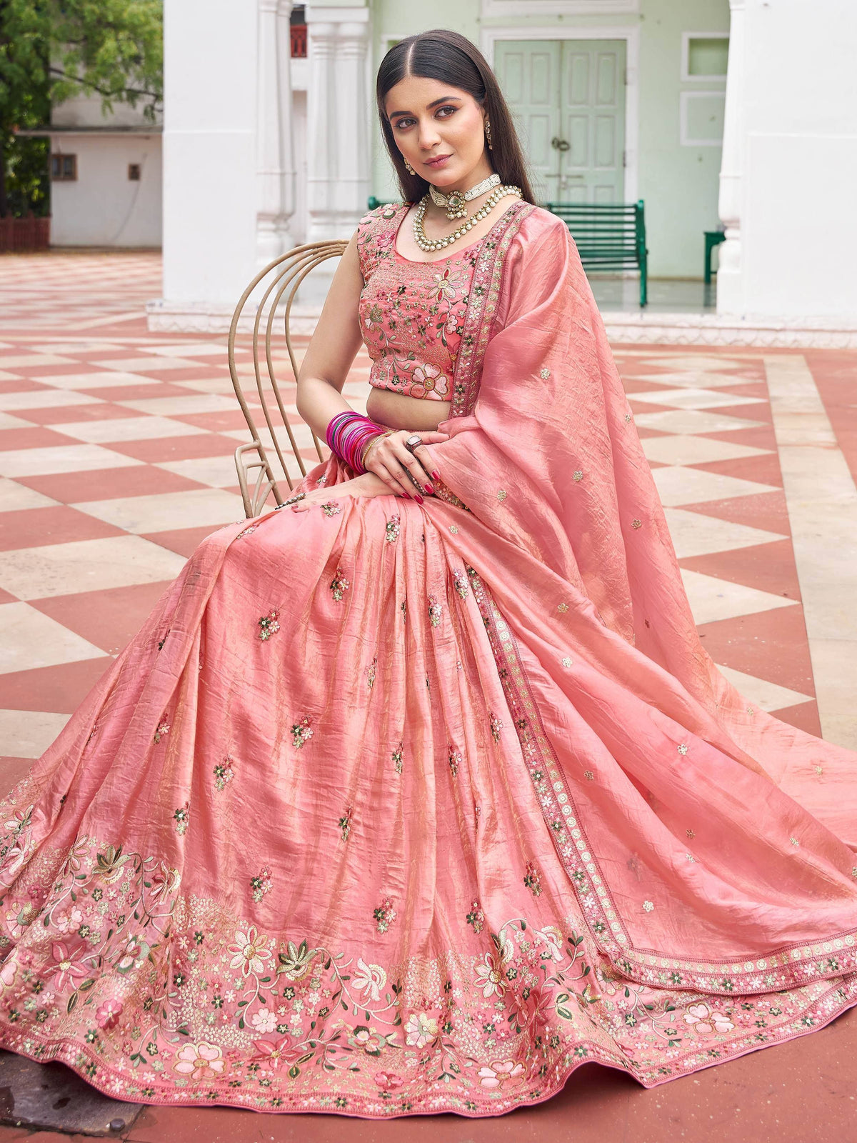 Pink embroidered lehenga choli with floral motifs, perfect for Indian ethnic wear occasions