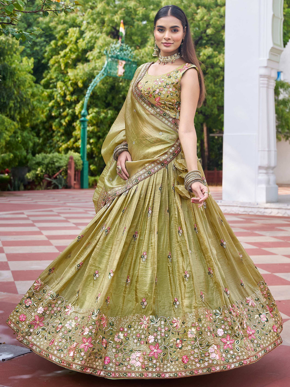 Olive green designer lehenga choli with floral embroidery, perfect for Indian weddings and festive occasions.