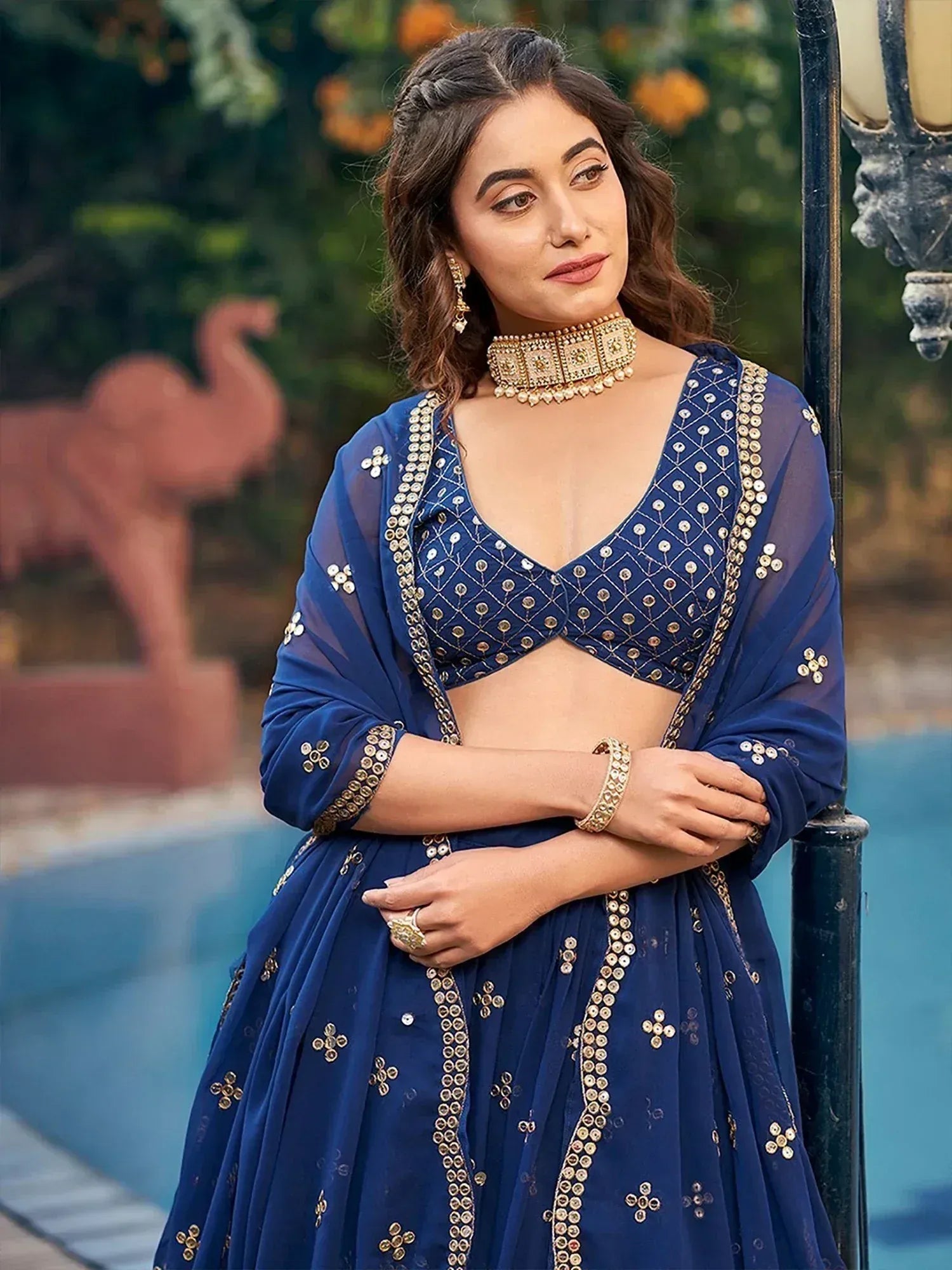 Blue designer lehenga choli with gold mirror work, perfect for Indian ethnic wear occasions