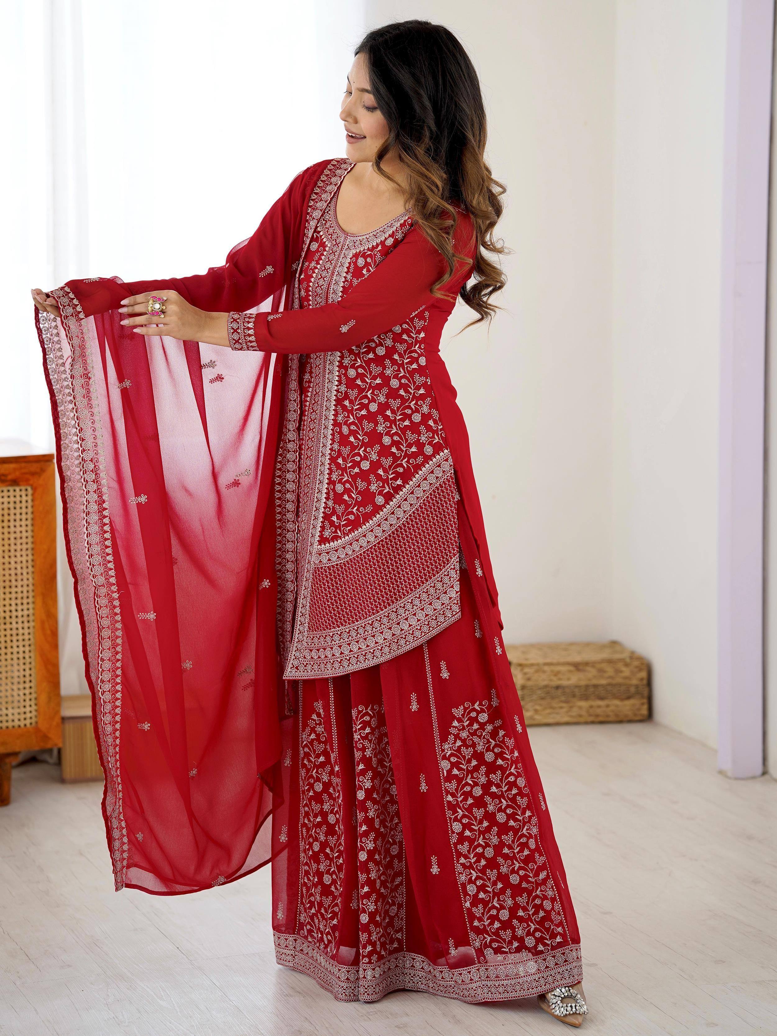 Red embroidered ethnic Anarkali suit with matching dupatta, perfect for Indian festive occasions