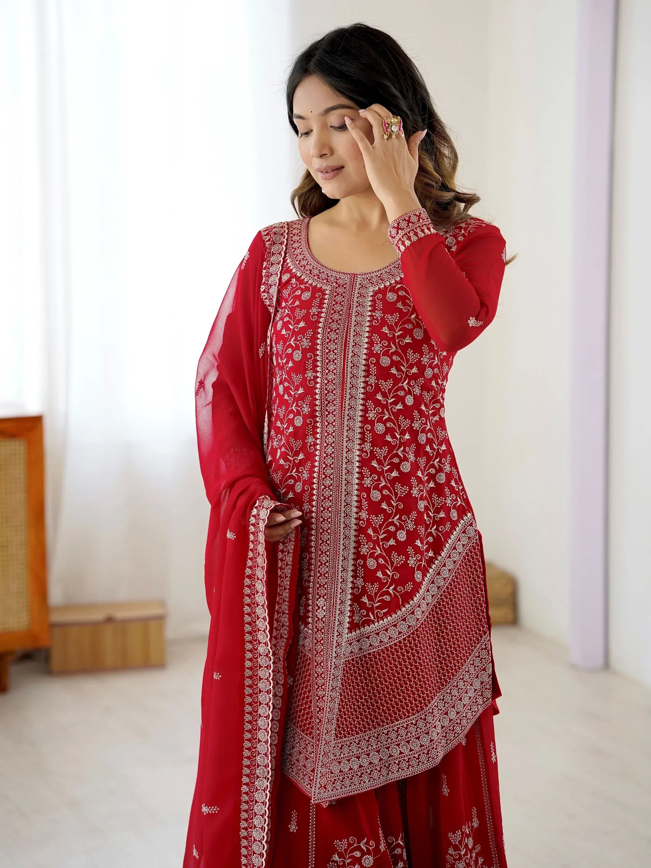 Red embroidered ethnic salwar kameez with floral detailing, perfect for Indian festive occasions
