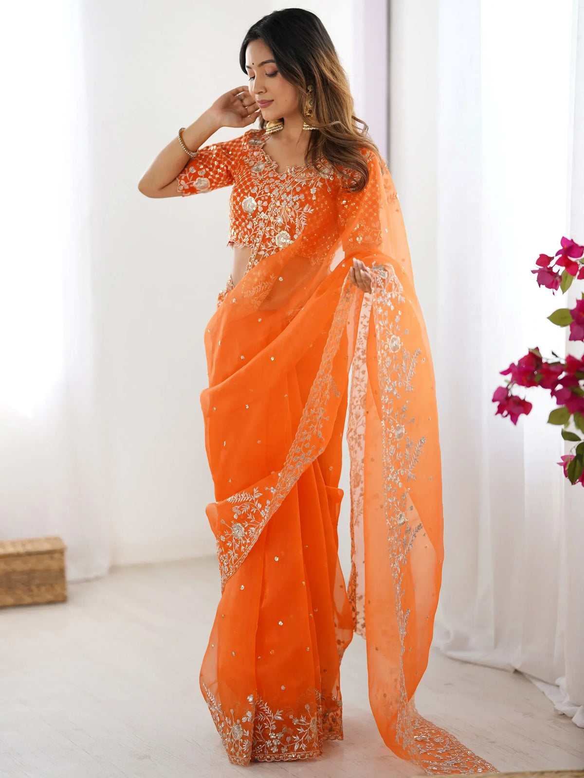 Orange embroidered saree with matching blouse, perfect for Indian ethnic wear occasions