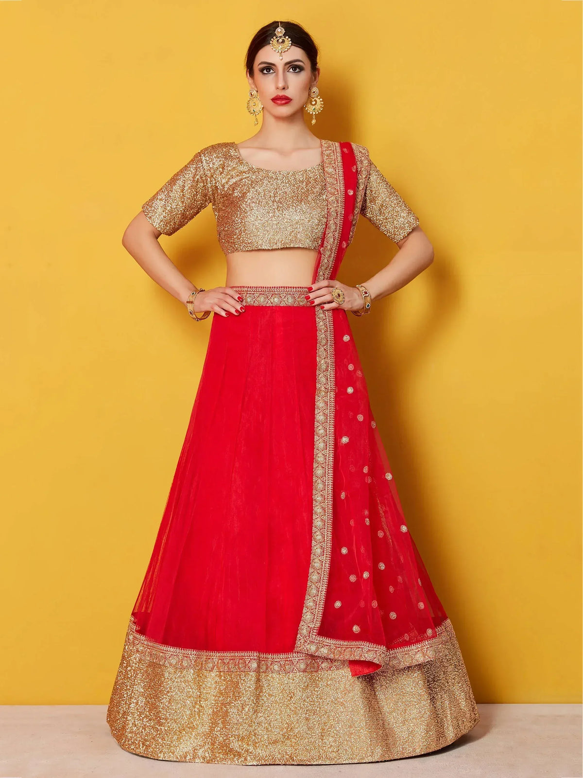 Red and gold designer lehenga choli with sequin blouse and embroidered skirt, perfect for Indian weddings