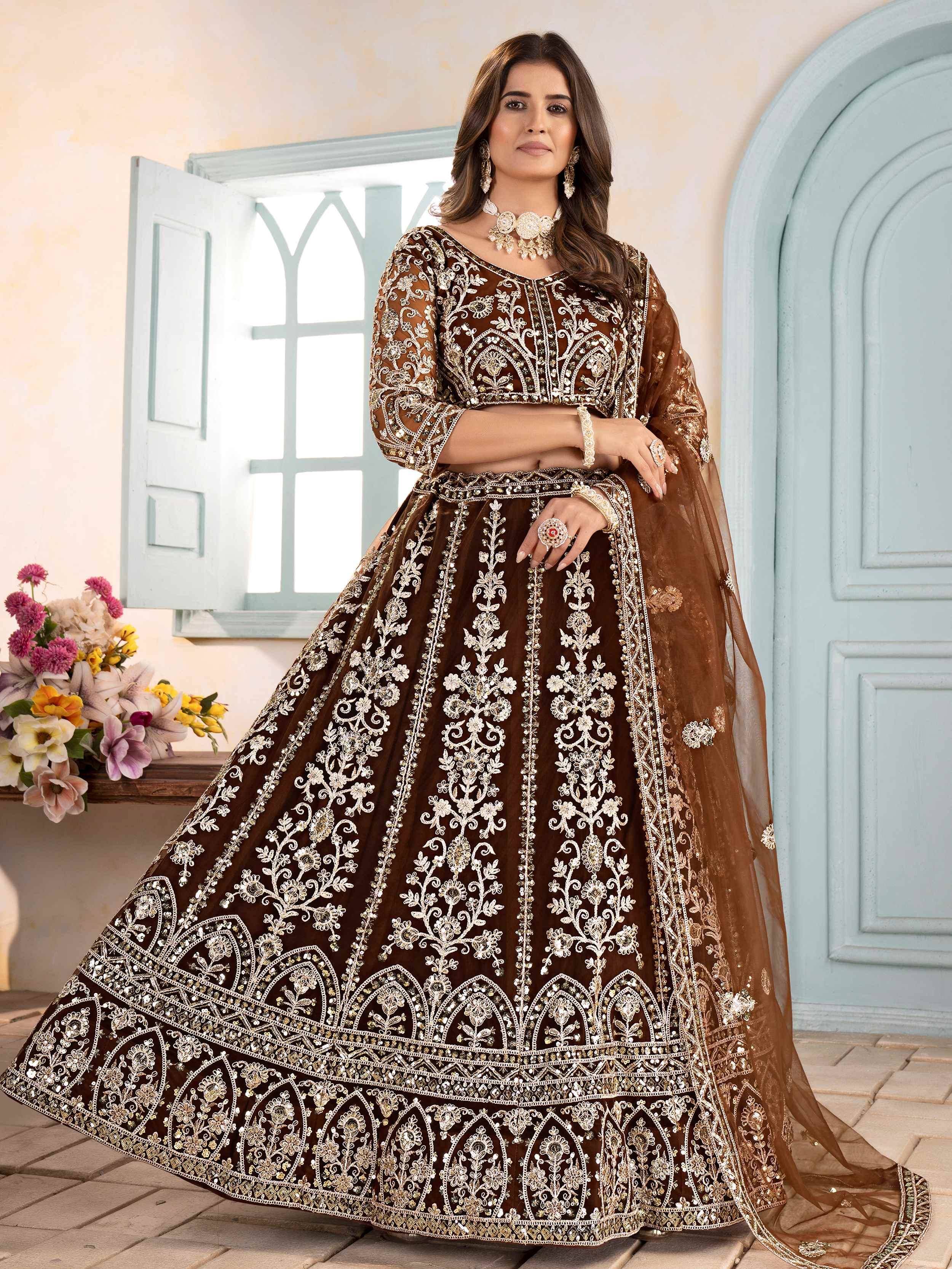 Brown embroidered lehenga choli with gold floral work, perfect for Indian weddings and festive occasions.