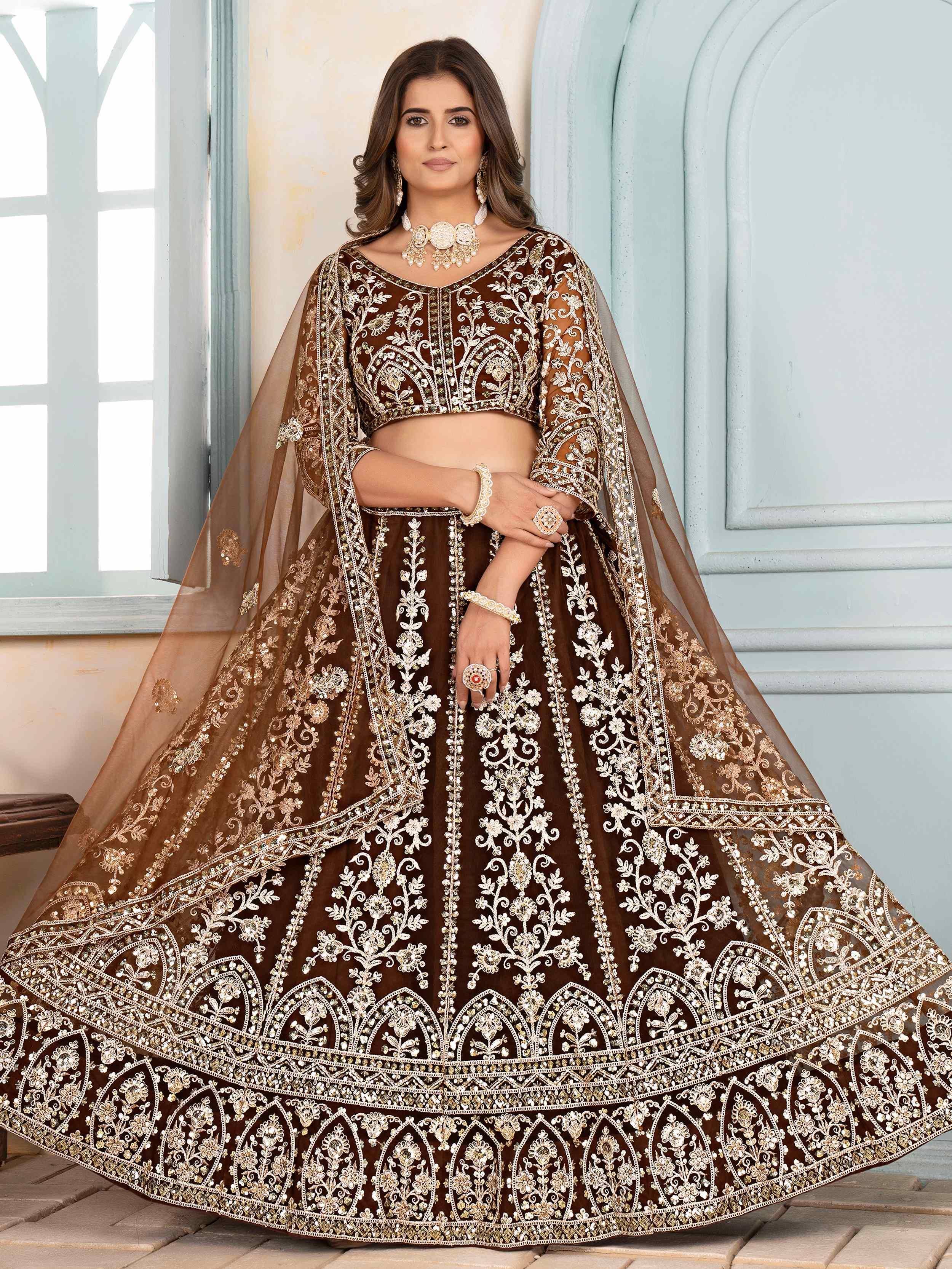 Brown embroidered lehenga choli with gold floral work, perfect for weddings and festive occasions.