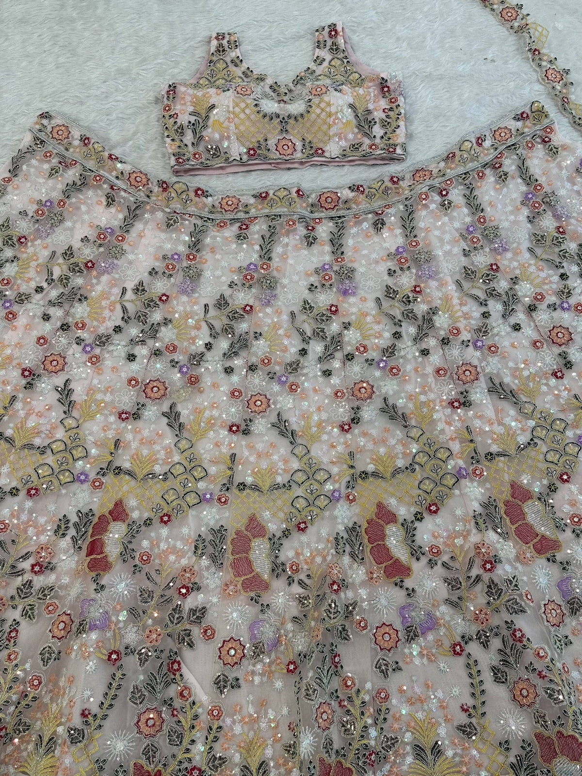 Notable Dusty Peach Dori Embroidered Net Party Wear Lehenga Choli