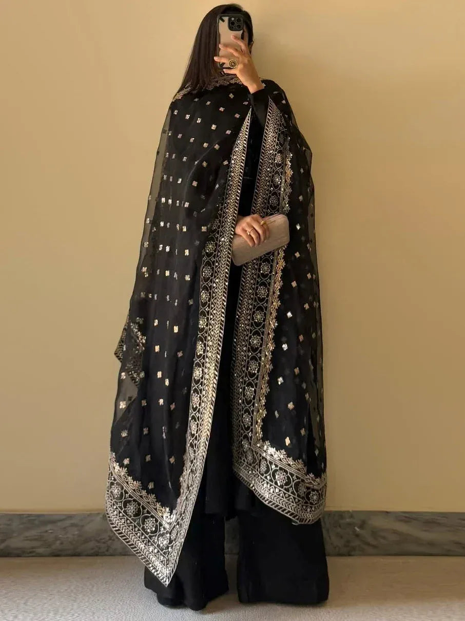 Black embroidered dupatta with gold detailing, paired with ethnic wear for festive occasions
