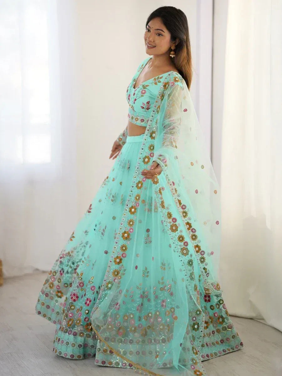 Mint green floral embroidered lehenga choli with sheer dupatta, perfect for Indian ethnic occasions