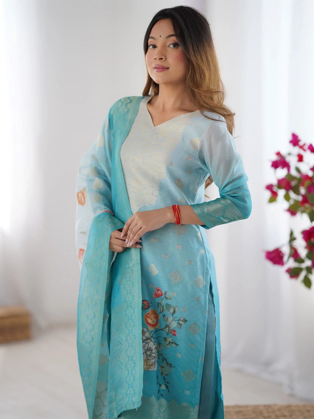 Woman in light blue floral printed ethnic kurta with matching dupatta, ideal for Indian occasions