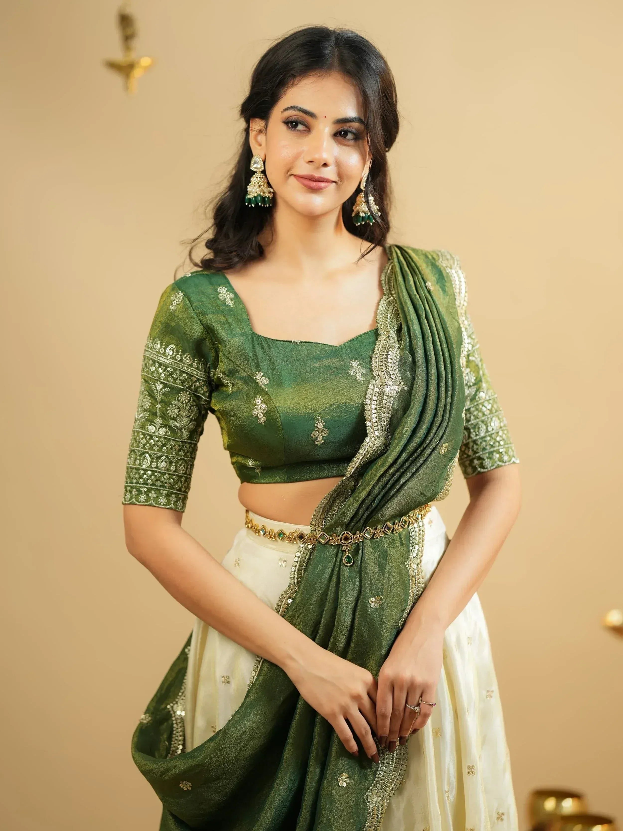 Green embroidered lehenga choli with gold detailing, perfect for Indian ethnic wear occasions