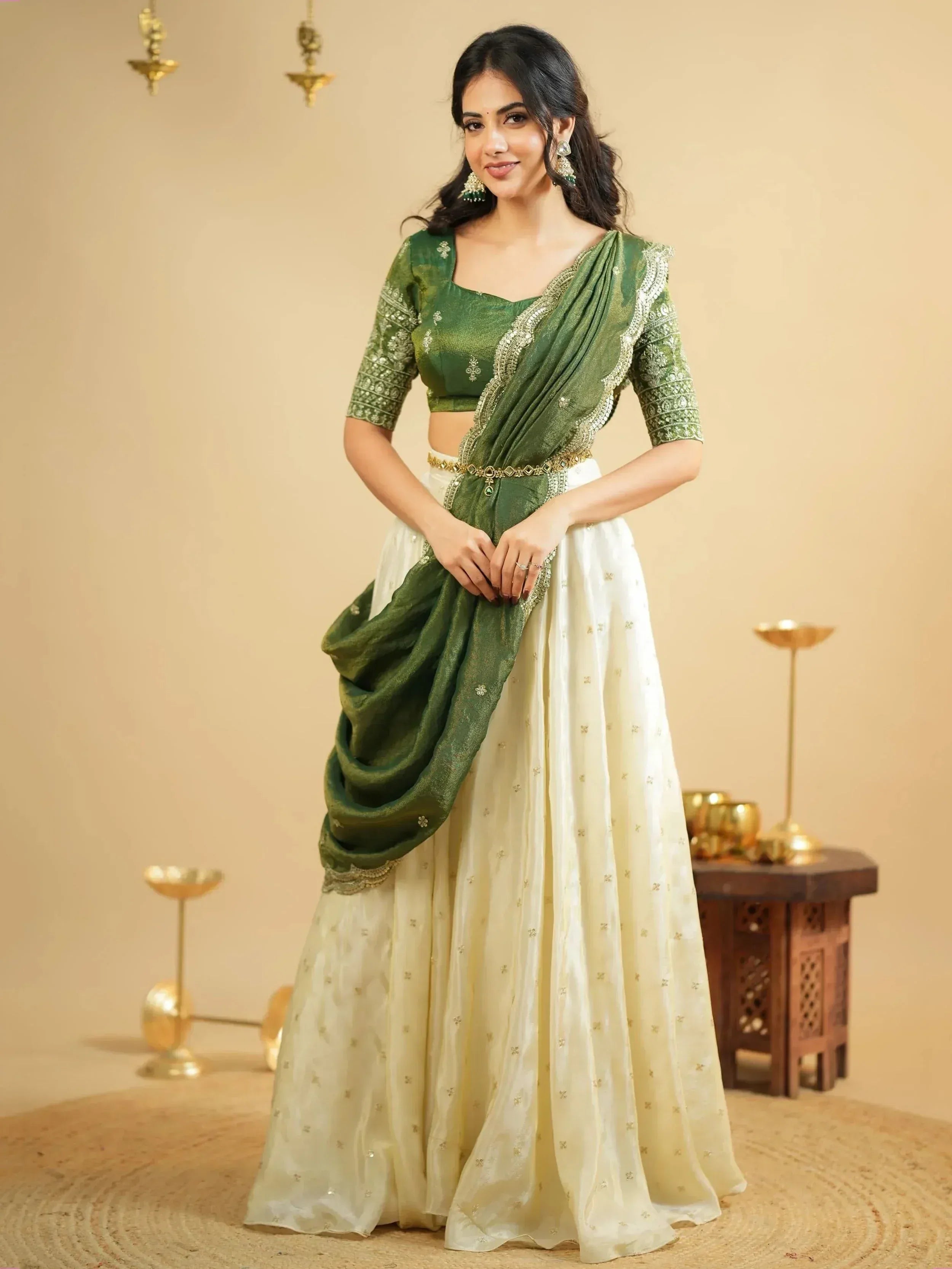 Green and cream designer lehenga choli with gold embroidery, perfect for Indian ethnic occasions
