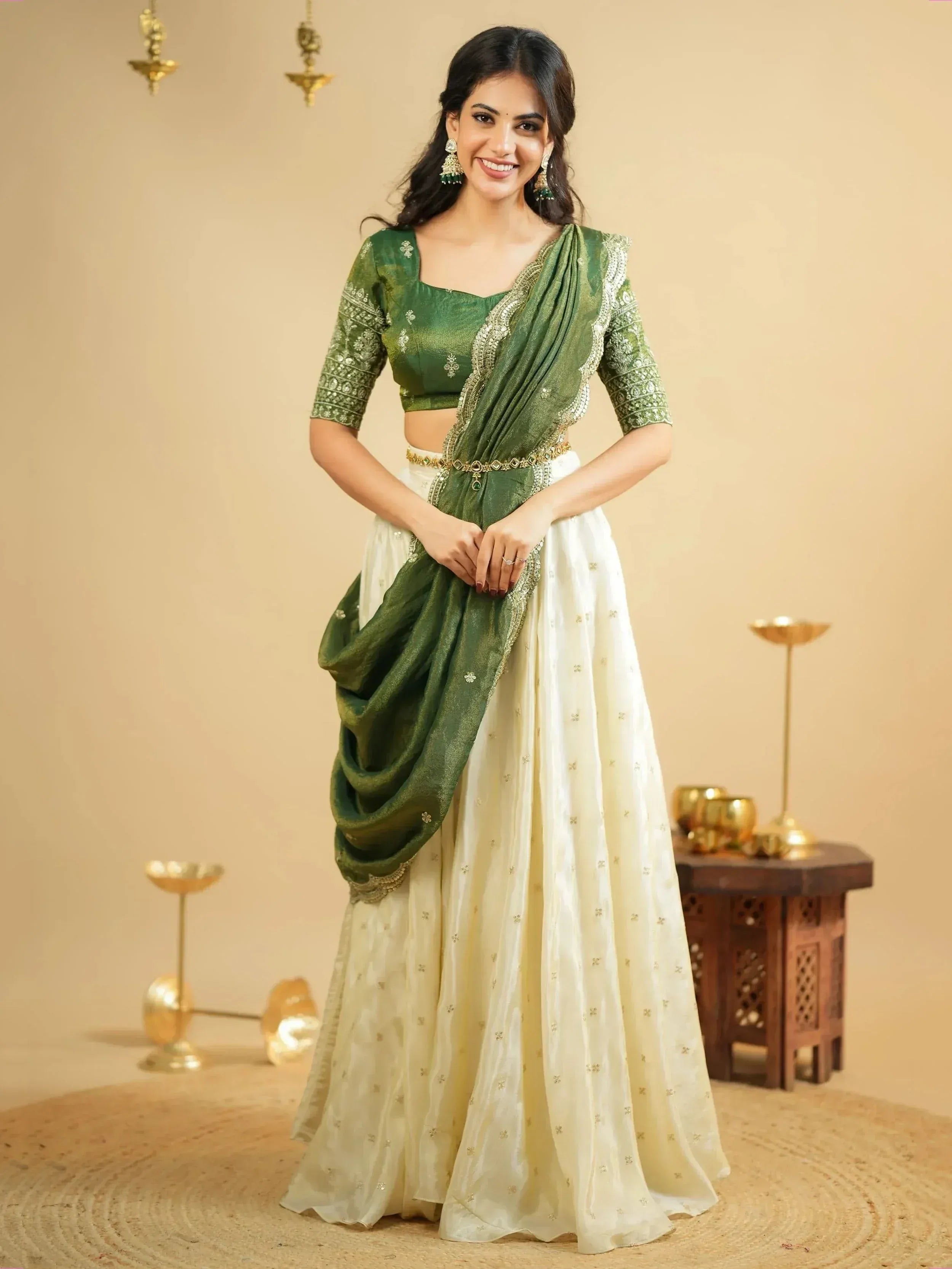 Green and ivory designer lehenga choli with gold embroidery, perfect for Indian ethnic wear occasions