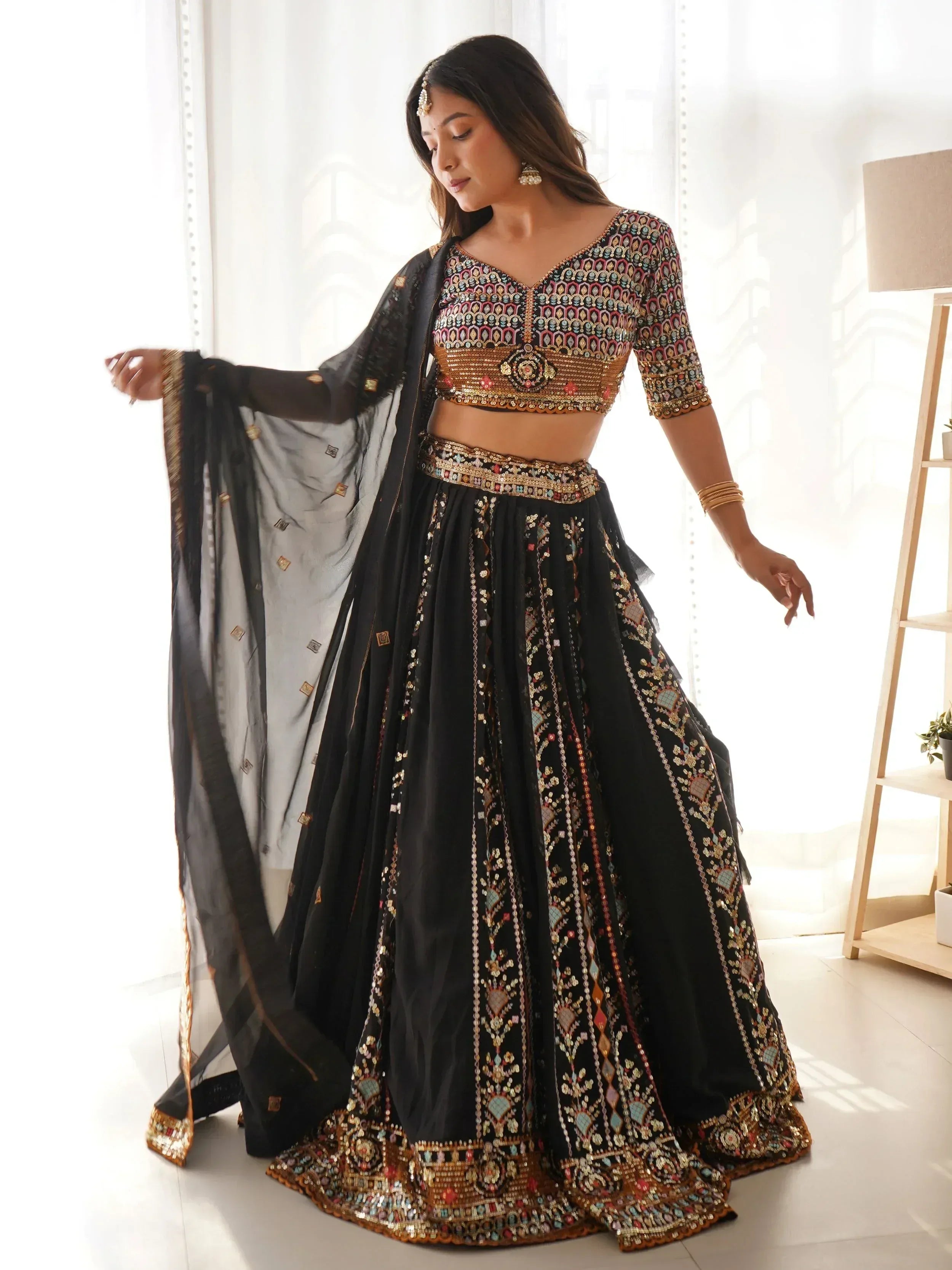 Black embroidered lehenga choli with sequin work, perfect for Indian ethnic wear and festive occasions.