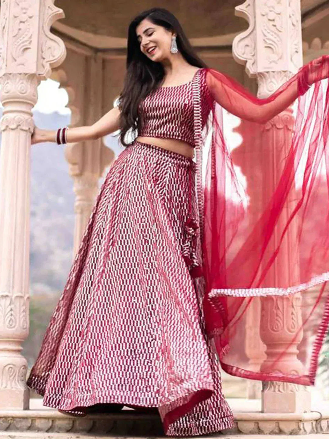 Red and white patterned lehenga choli with sheer dupatta, perfect for Indian ethnic wear occasions