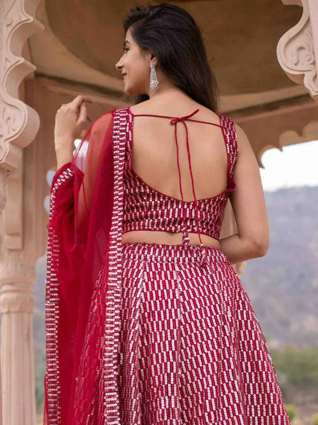 Red sequin lehenga choli with back tie detail, ethnic Indian wear for weddings and festivals